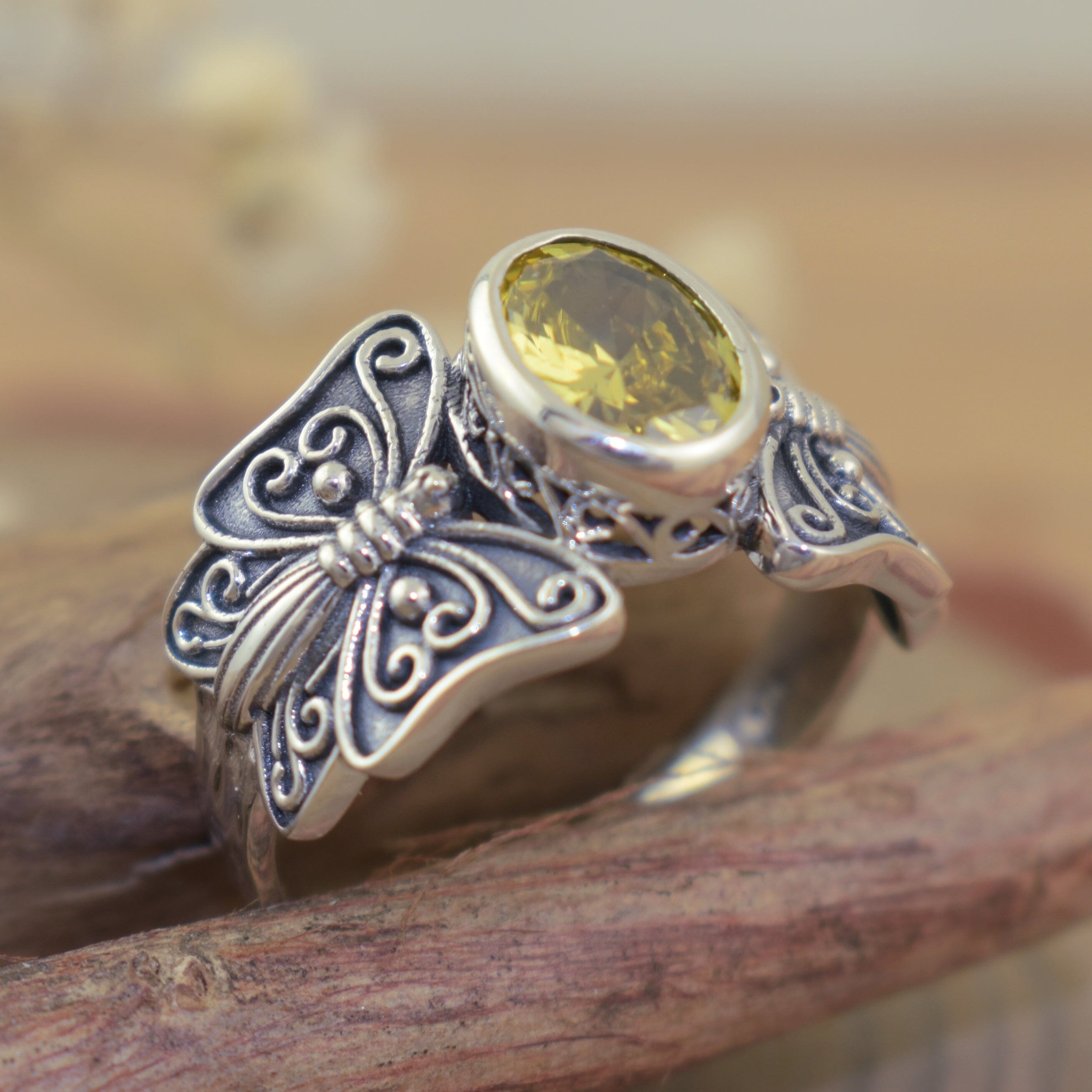 Designer butterfly ring with oval shaped yellow citrine CZ