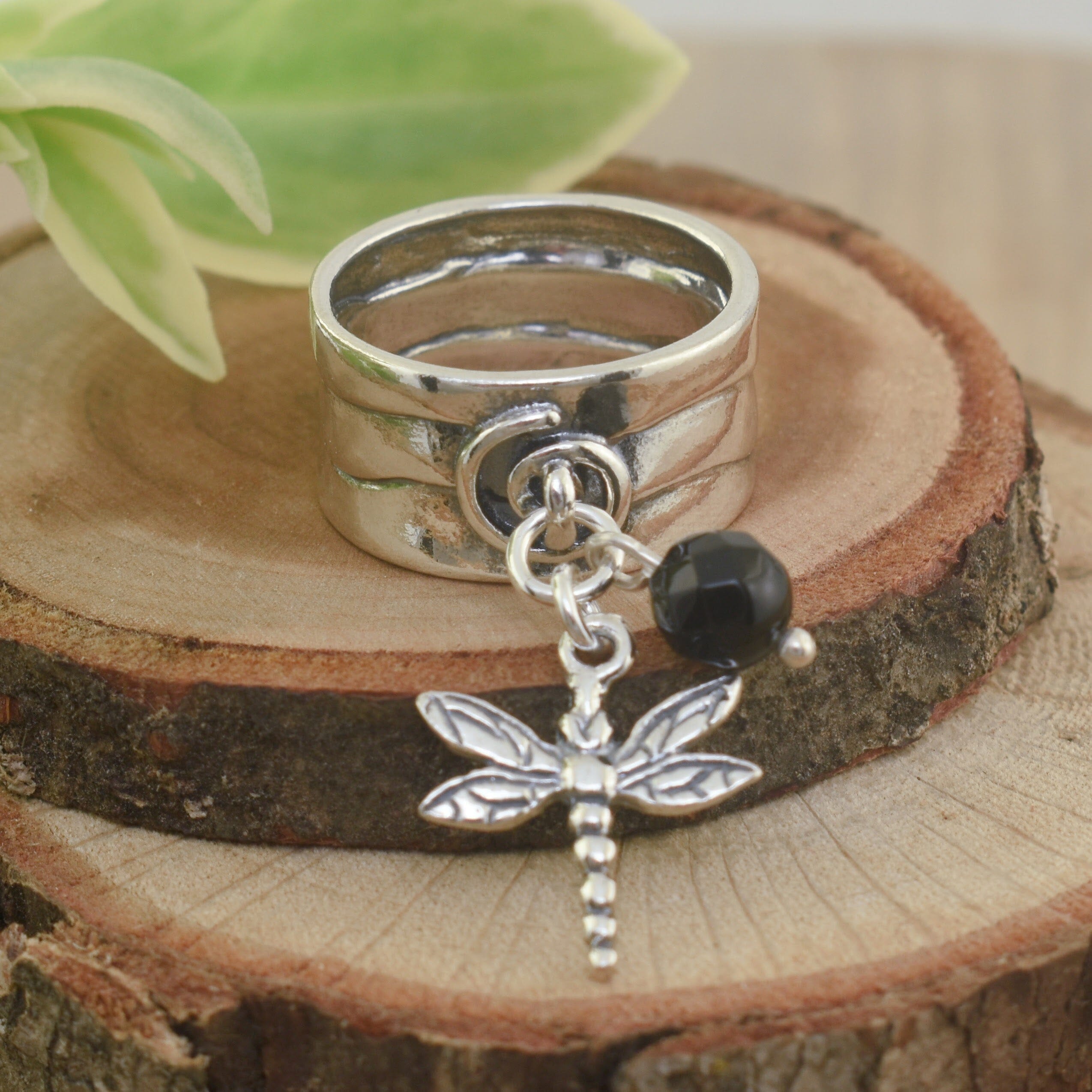 .925 sterling silver ring with dangling black onyx stone and dragonfly charm