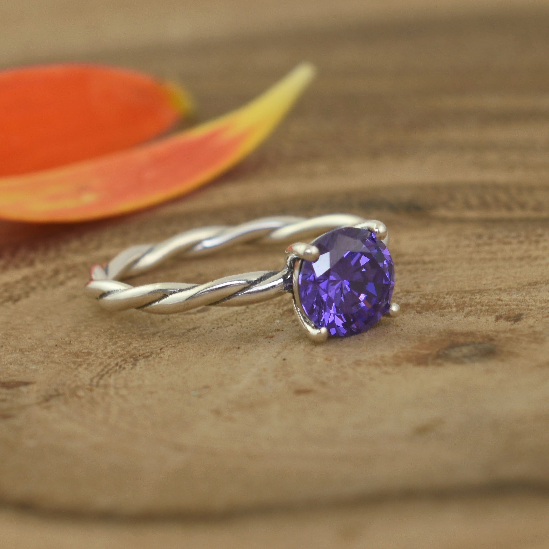 .925 sterling silver ring with twisted band and purple stone