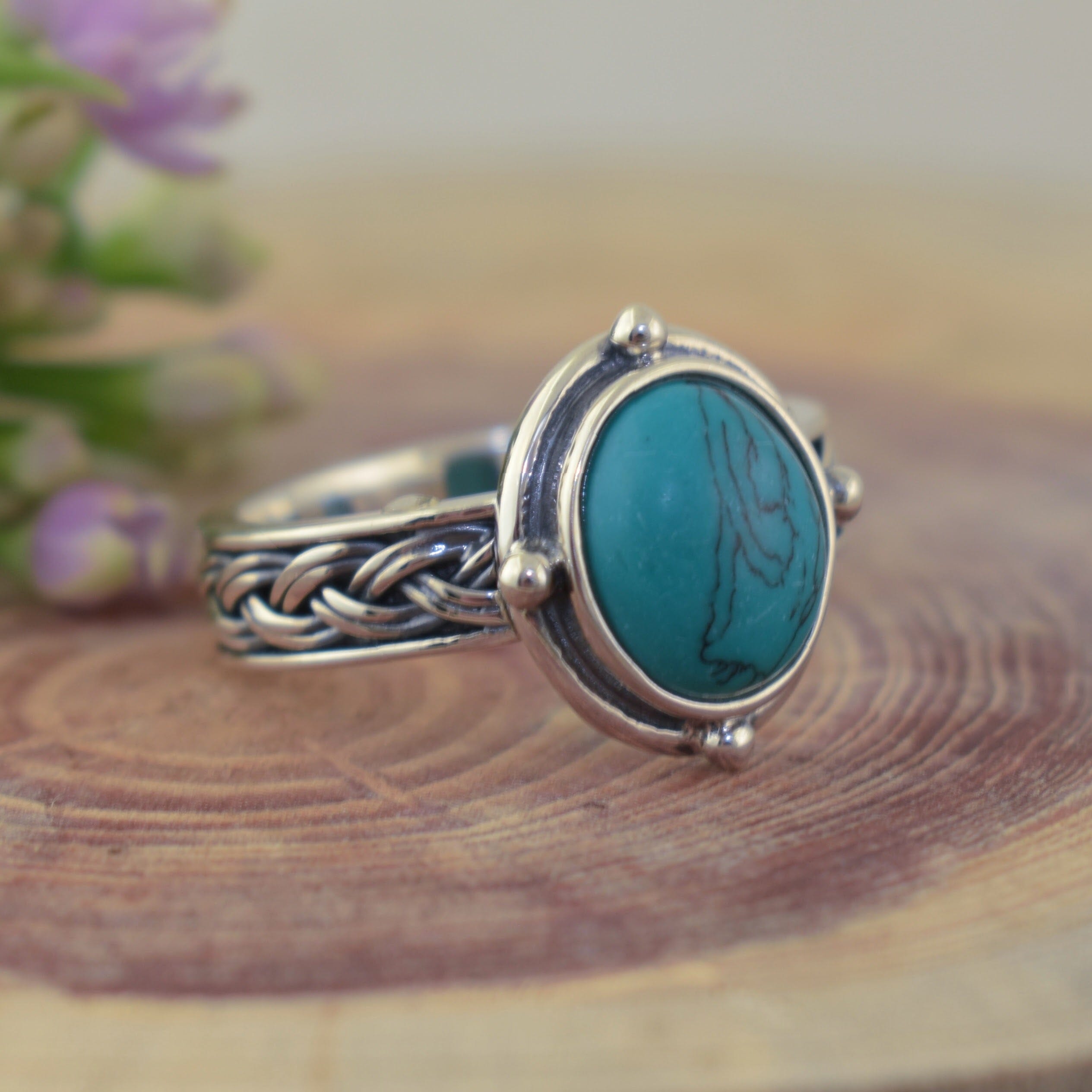 silver ring with a breaded band featuring a Howlite stone 