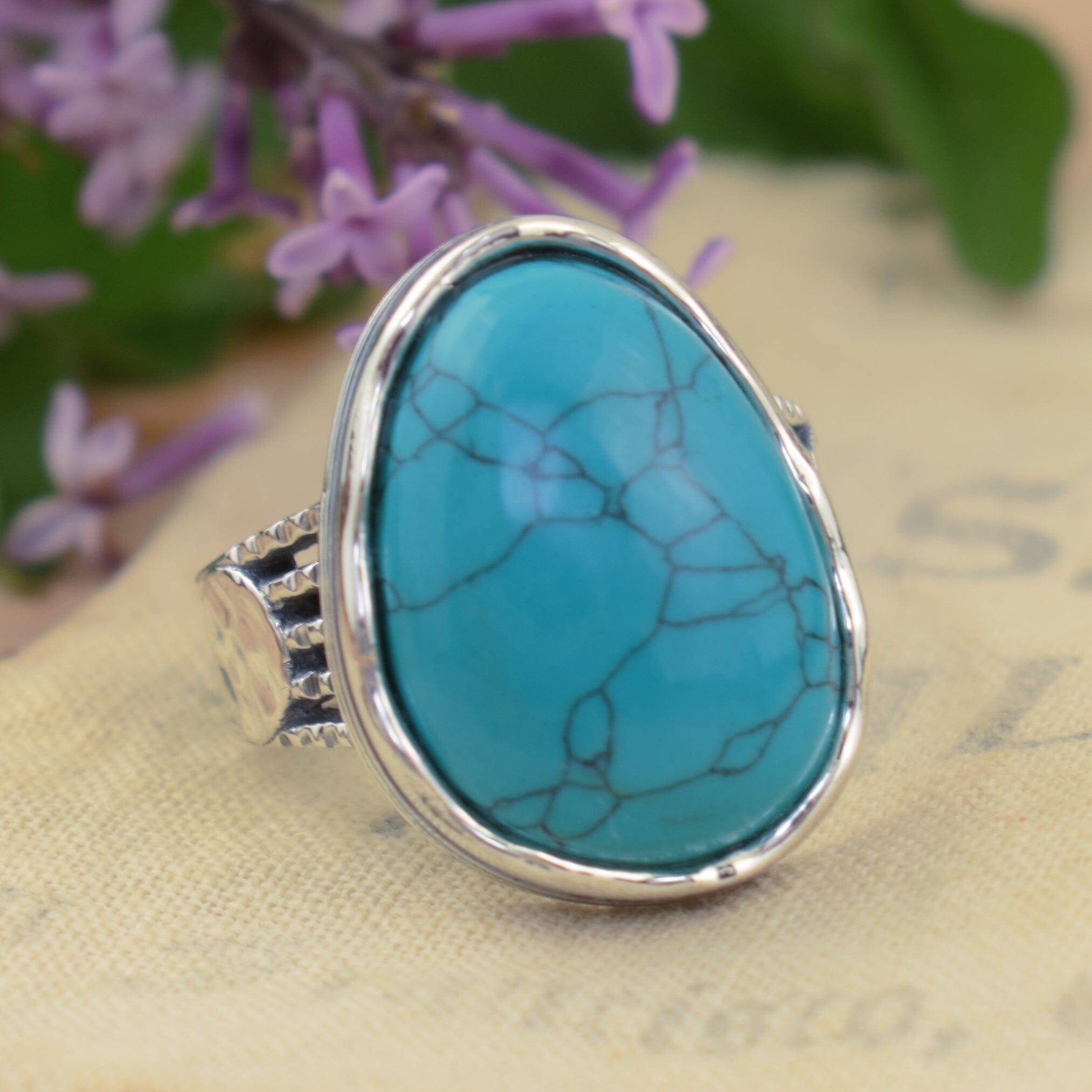 .925 sterling silver ring with large blue-green howlite stone