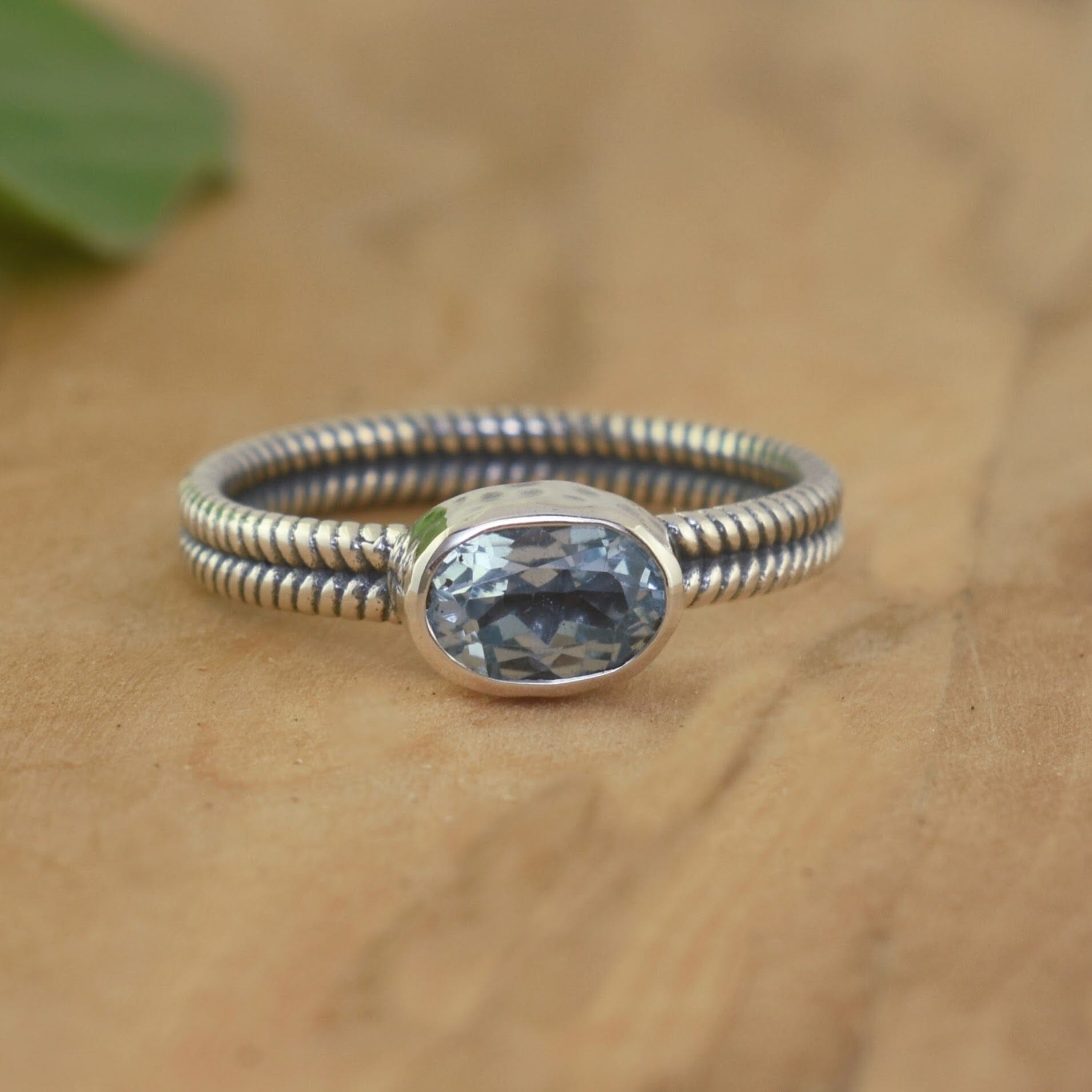 Handcrafted sterling silver ring with genuine blue topaz stone