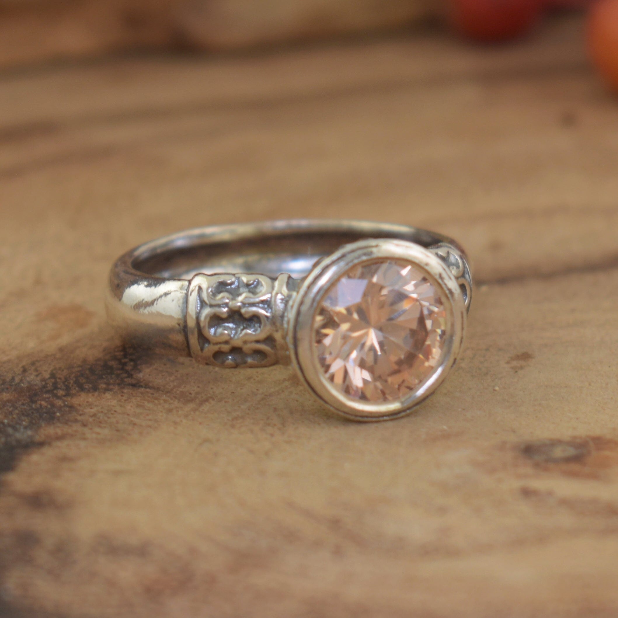 oxidized silver designer ring with a soft golden cz center