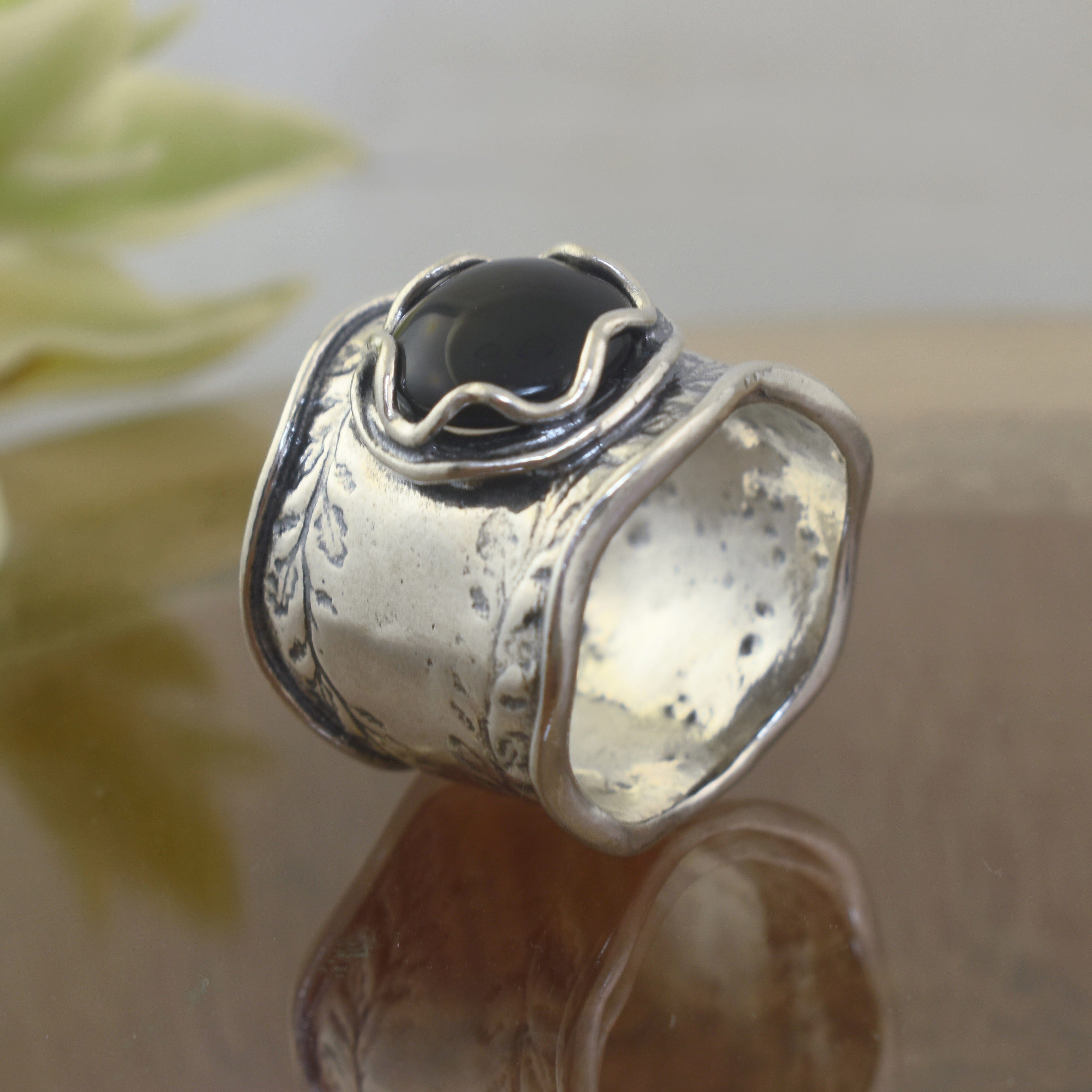 chunky floral ring in sterling silver with a rustic star bezel design