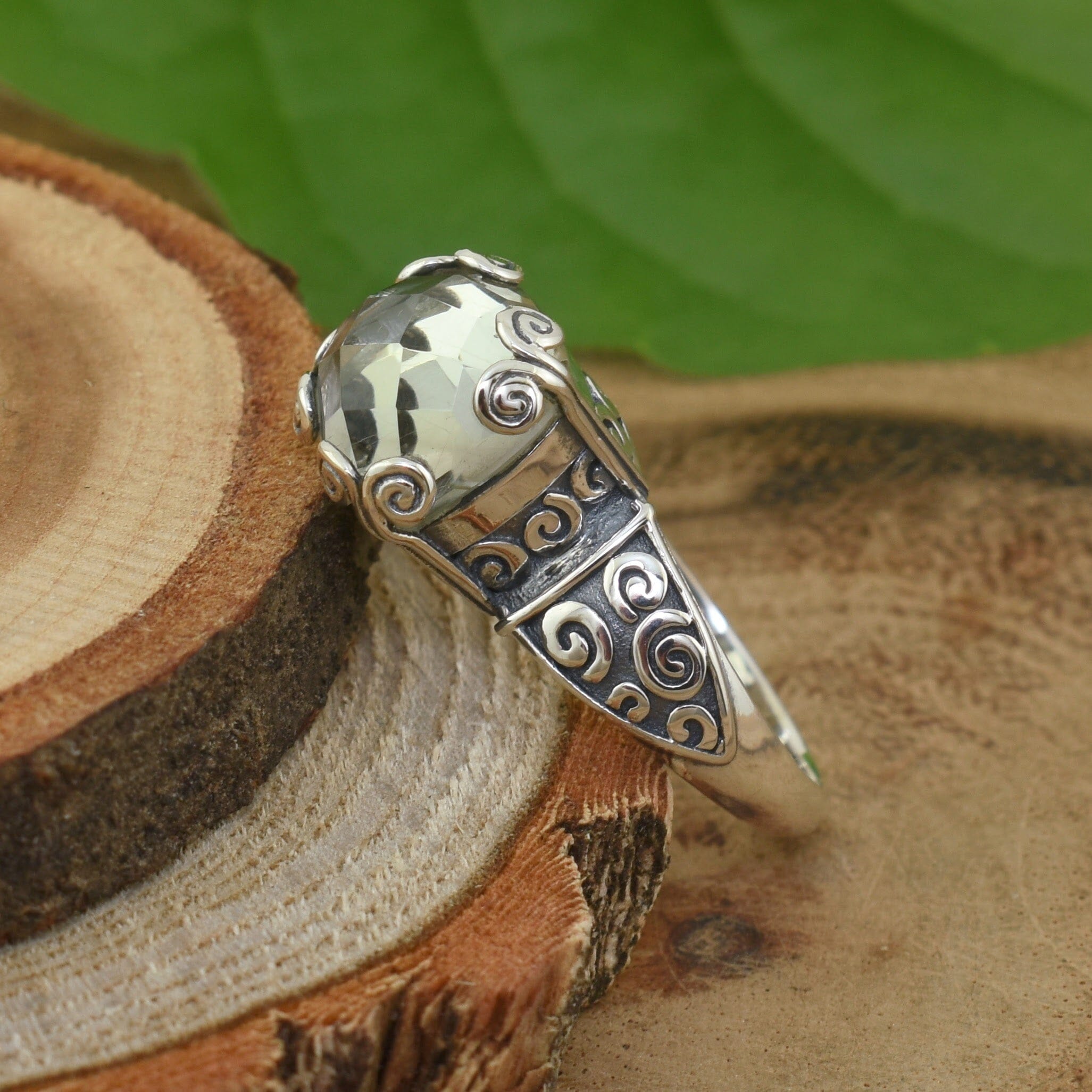 Sterling silver swirl ring with green stone