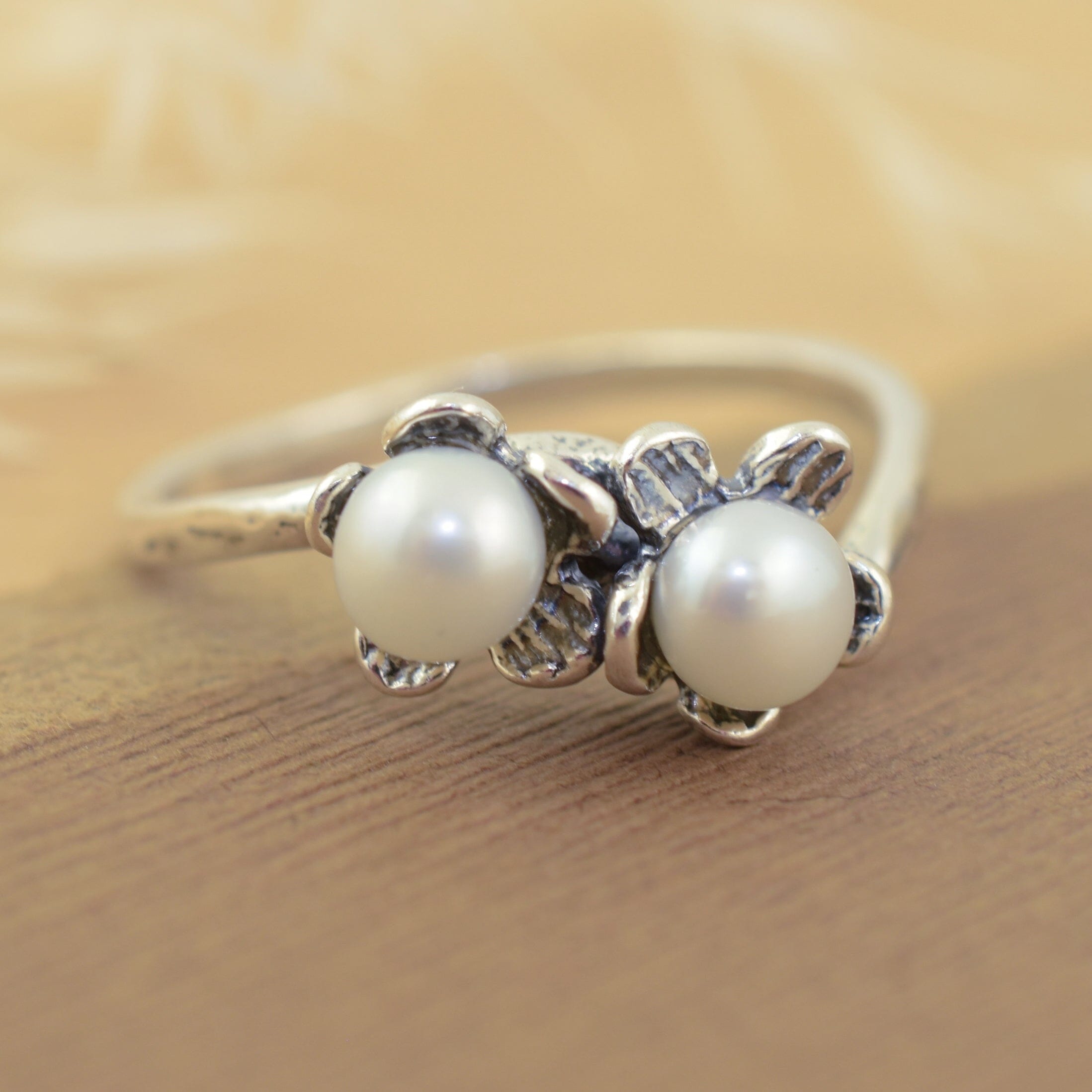 Double flower ring in sterling silver with white freshwater pearl accent stones