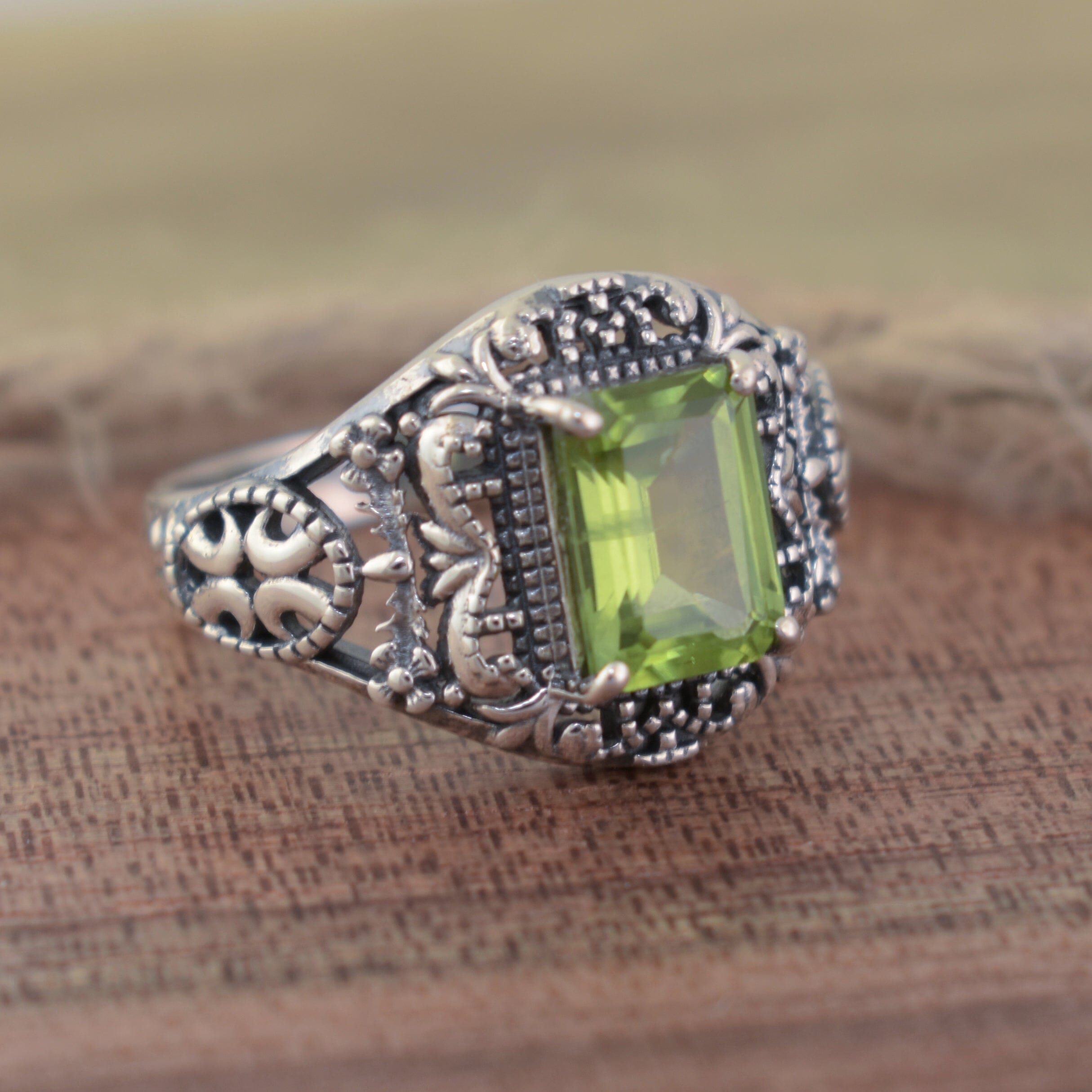 Silver ring with a green gemstone