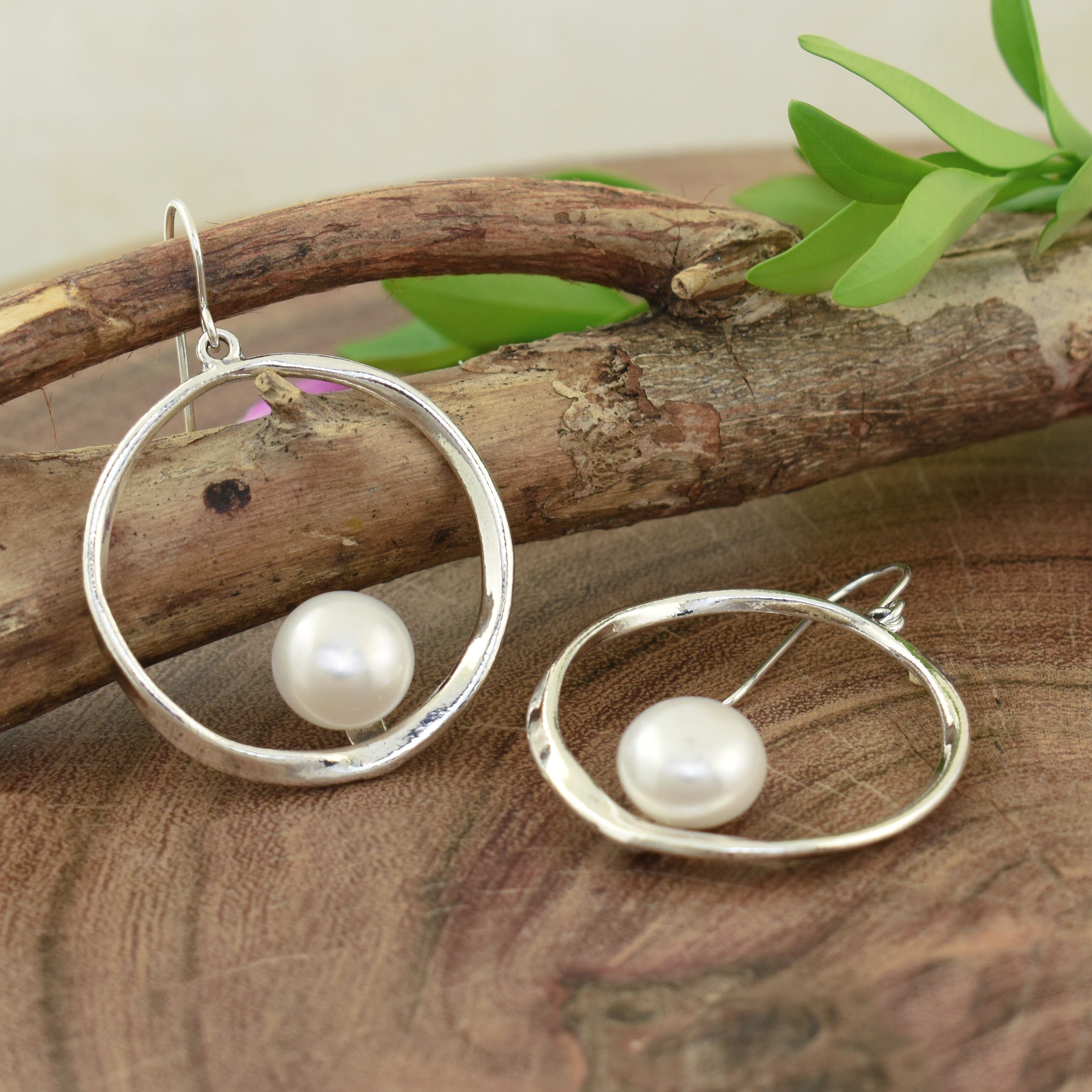 Round sterling silver earrings with pearl accent
