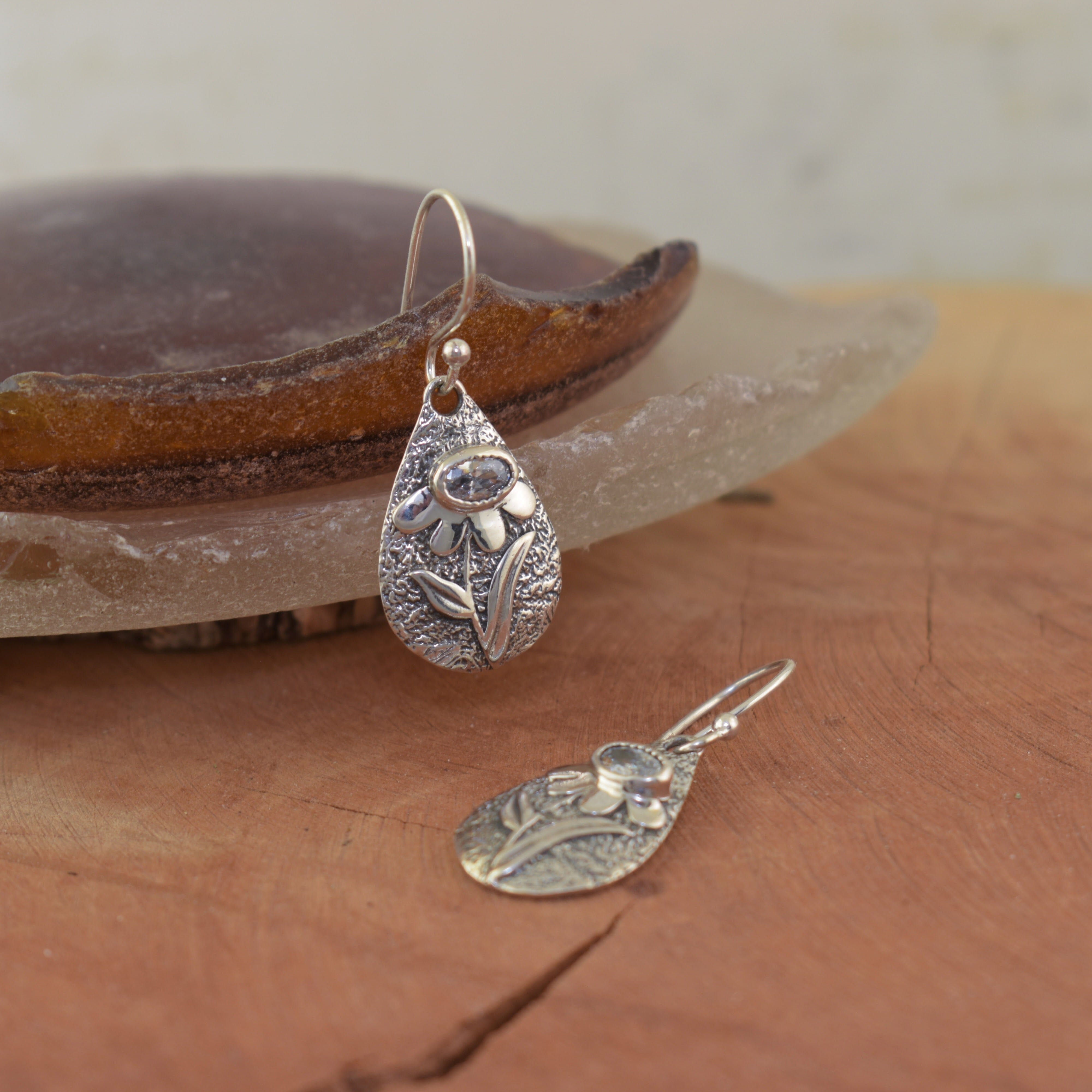 Flower design earrings with a CZ stone
