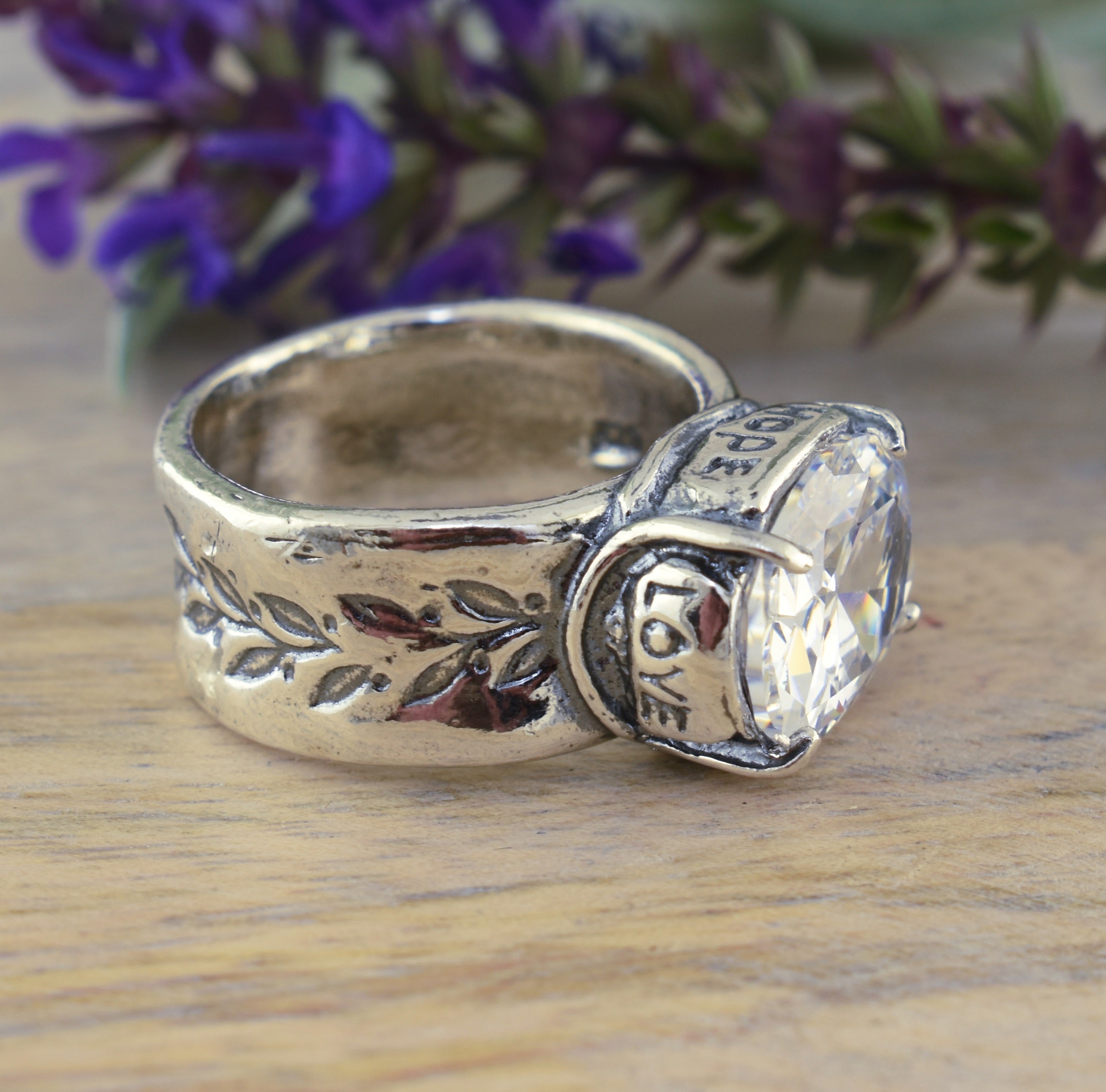 ring with engraved vines on the band and Hope and Love on the bezel