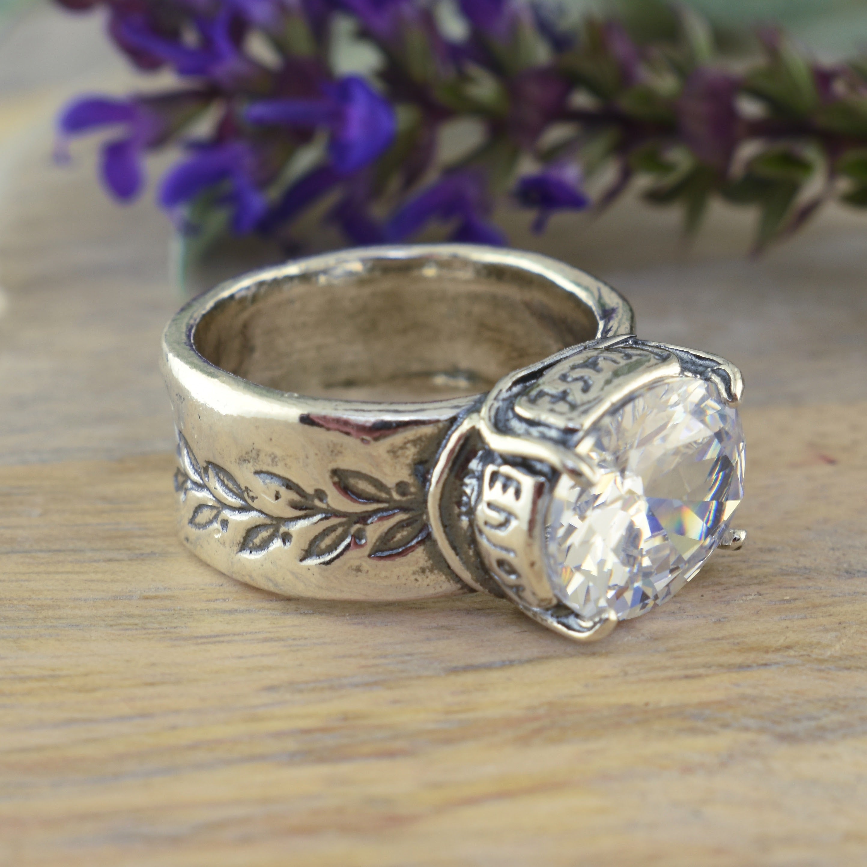 ring with engraved words Enjoy and Trust