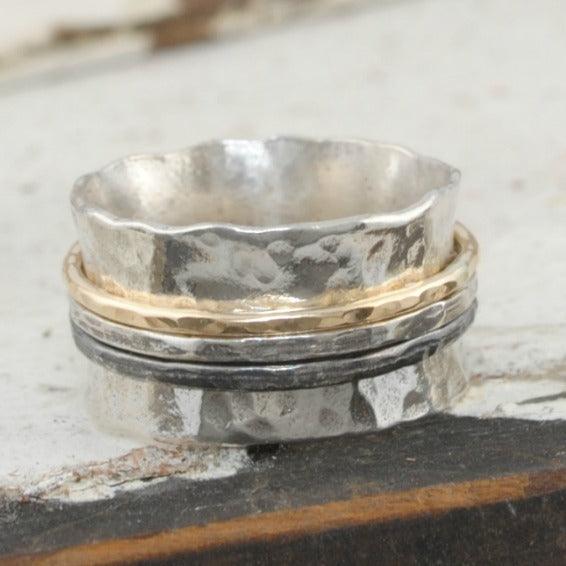 Sterling silver Hammered Band with three spinning bands in oxidized silver and gold-fillled.