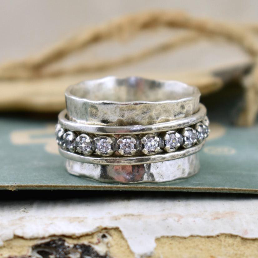 hammered sterling silver spin ring with cz