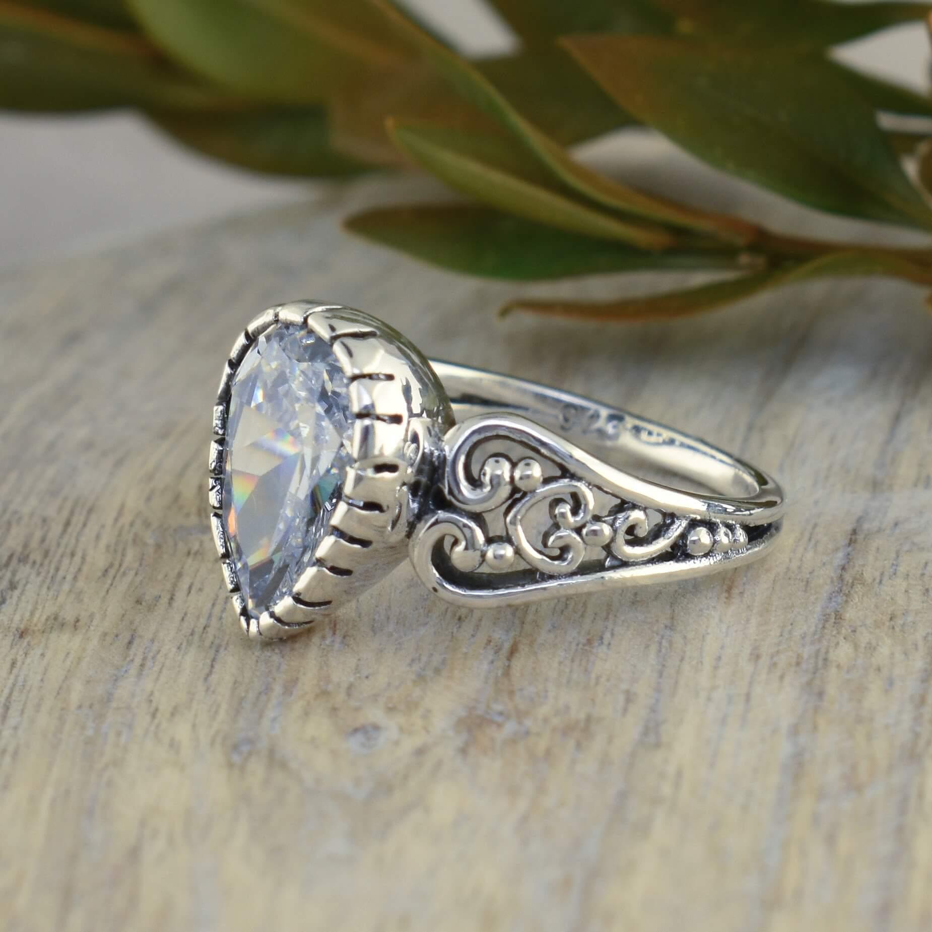 Antonia Ring with filigree styled band and center stone
