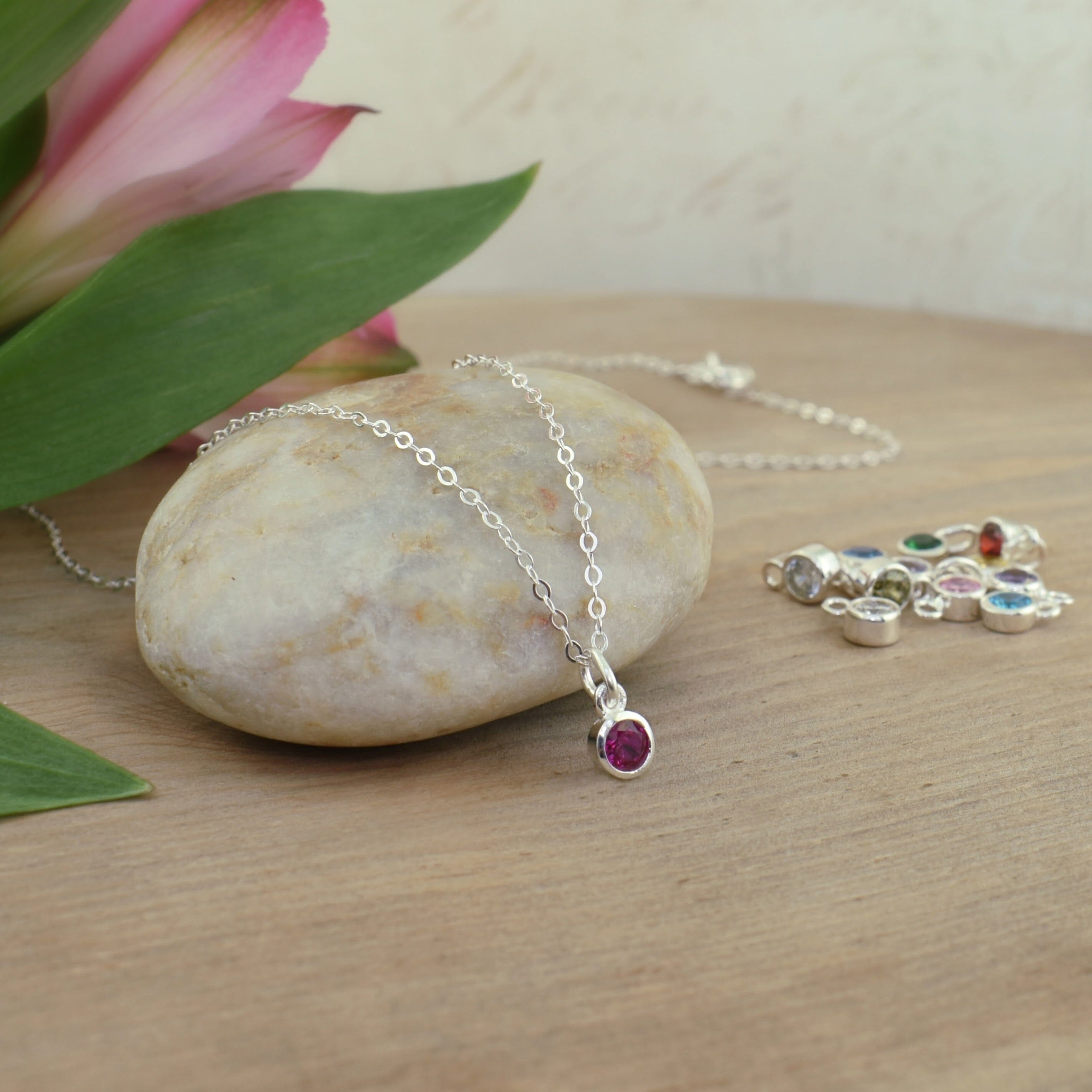 dainty sterling silver necklace featuring a birthstone