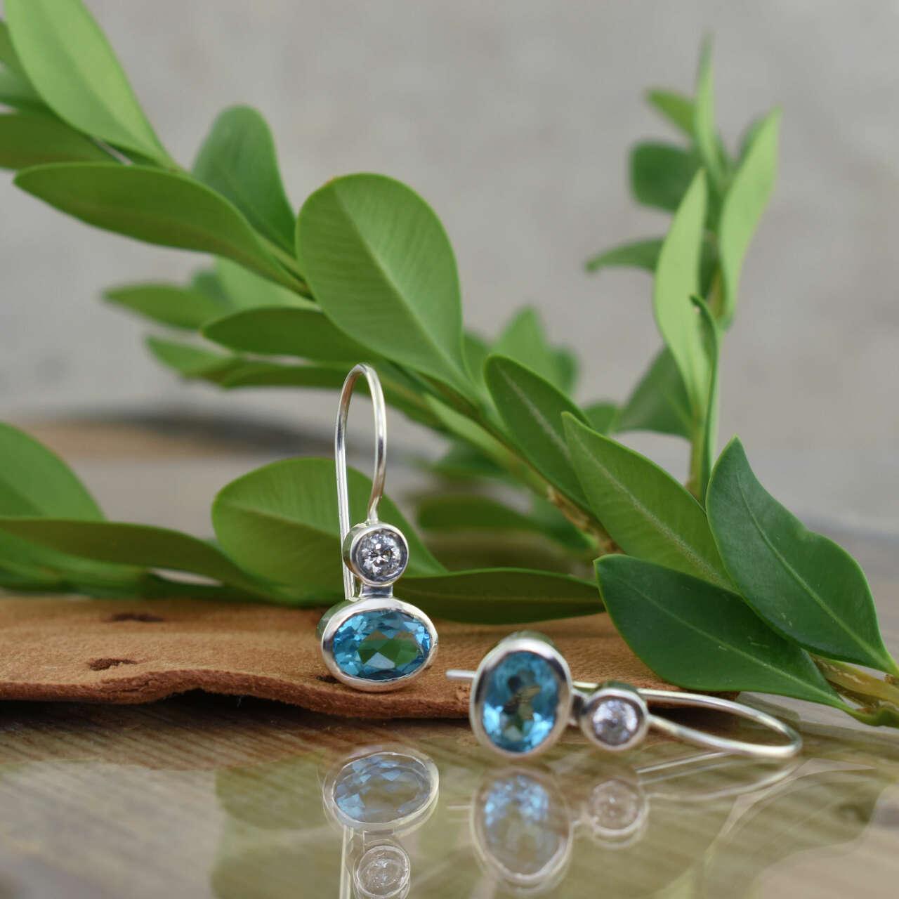 Sterling silver earrings with bezel set Clear and Capri Blue CZ