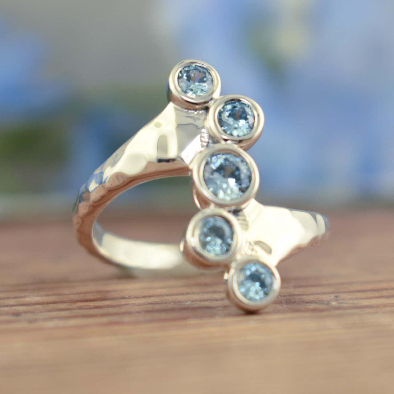 .925 sterling silver ring with five blue stones