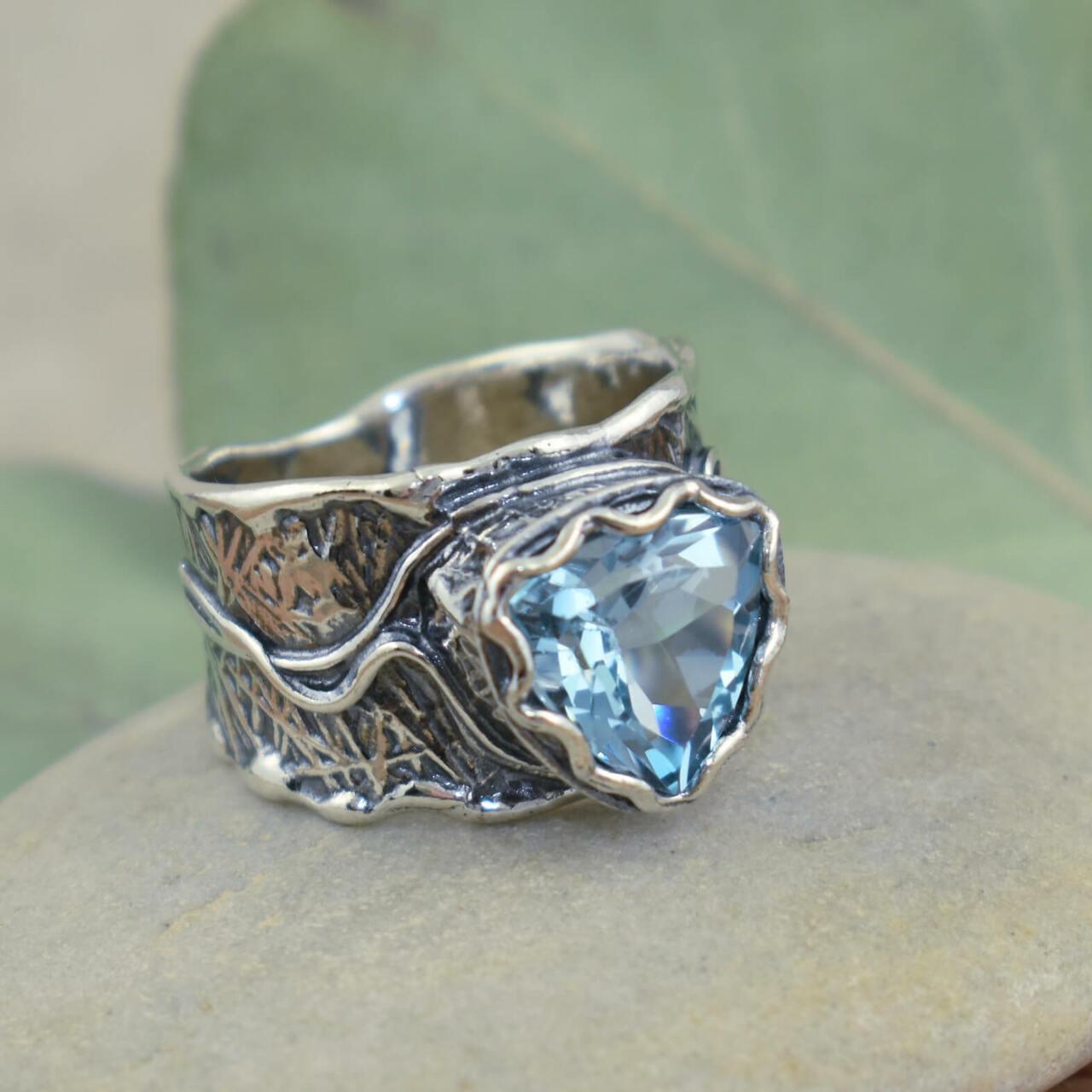 .925 sterling silver ring with light blue stone
