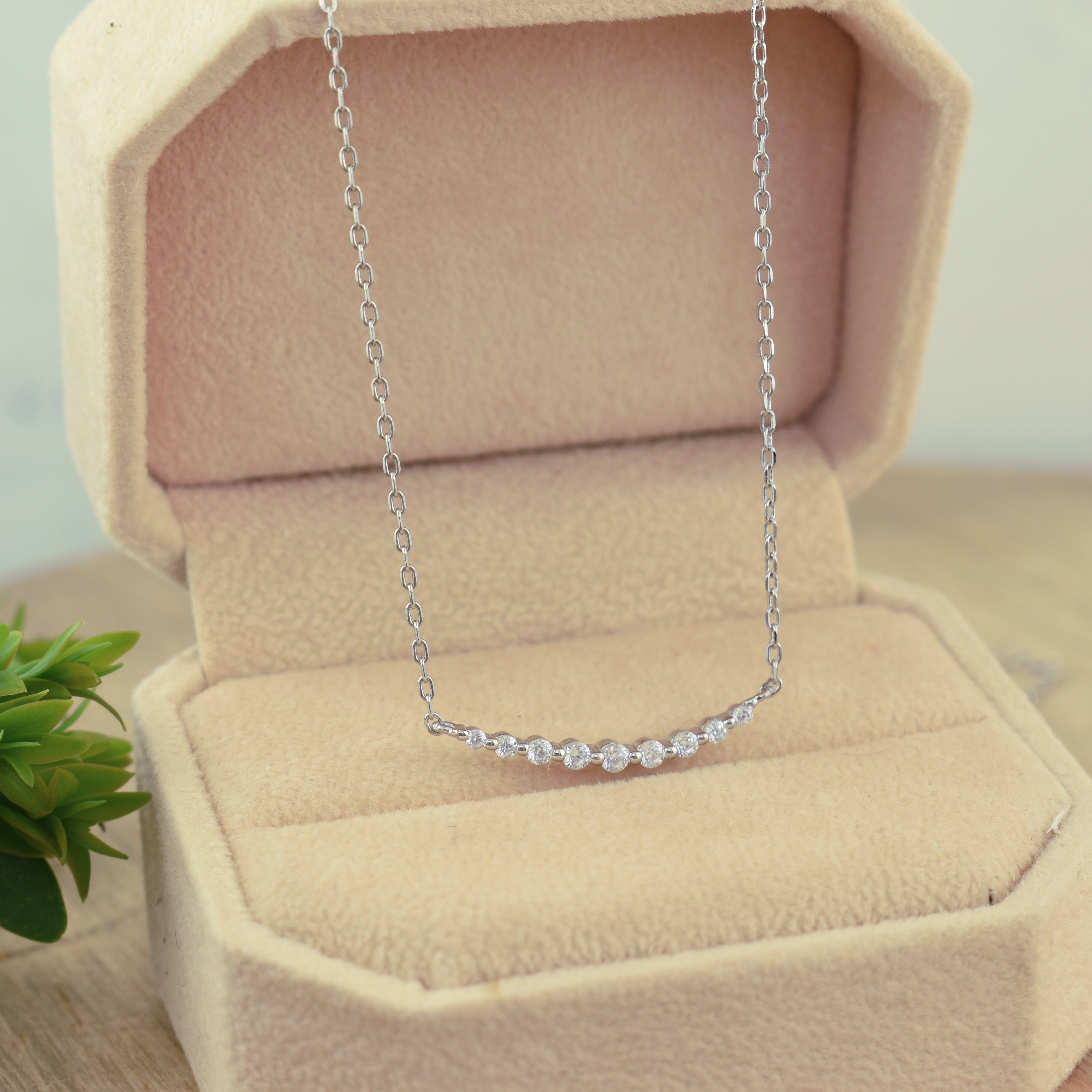 sterling silver minimalist necklace featuring nine CZs