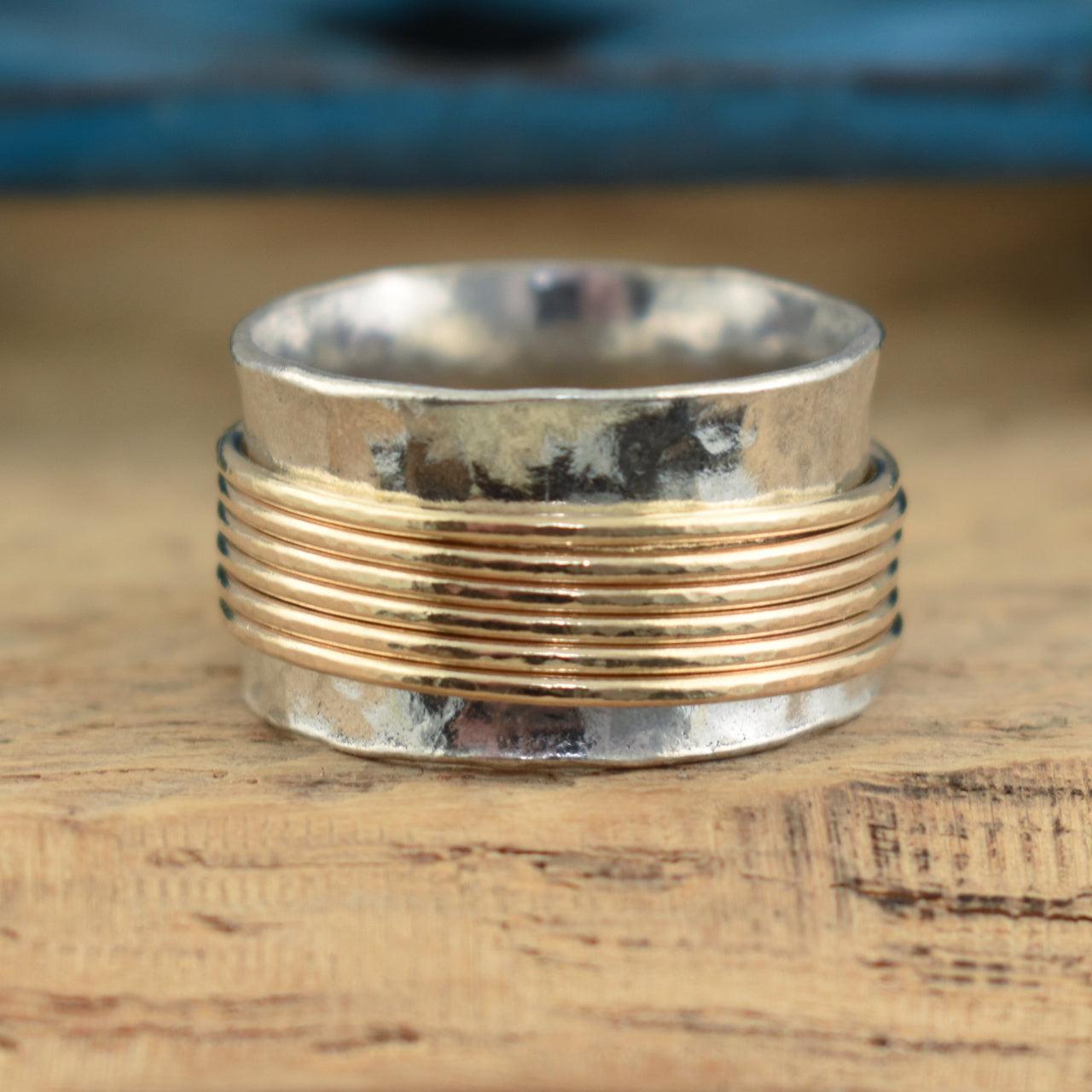 Sterling silver ring with six gold filled spinner bands