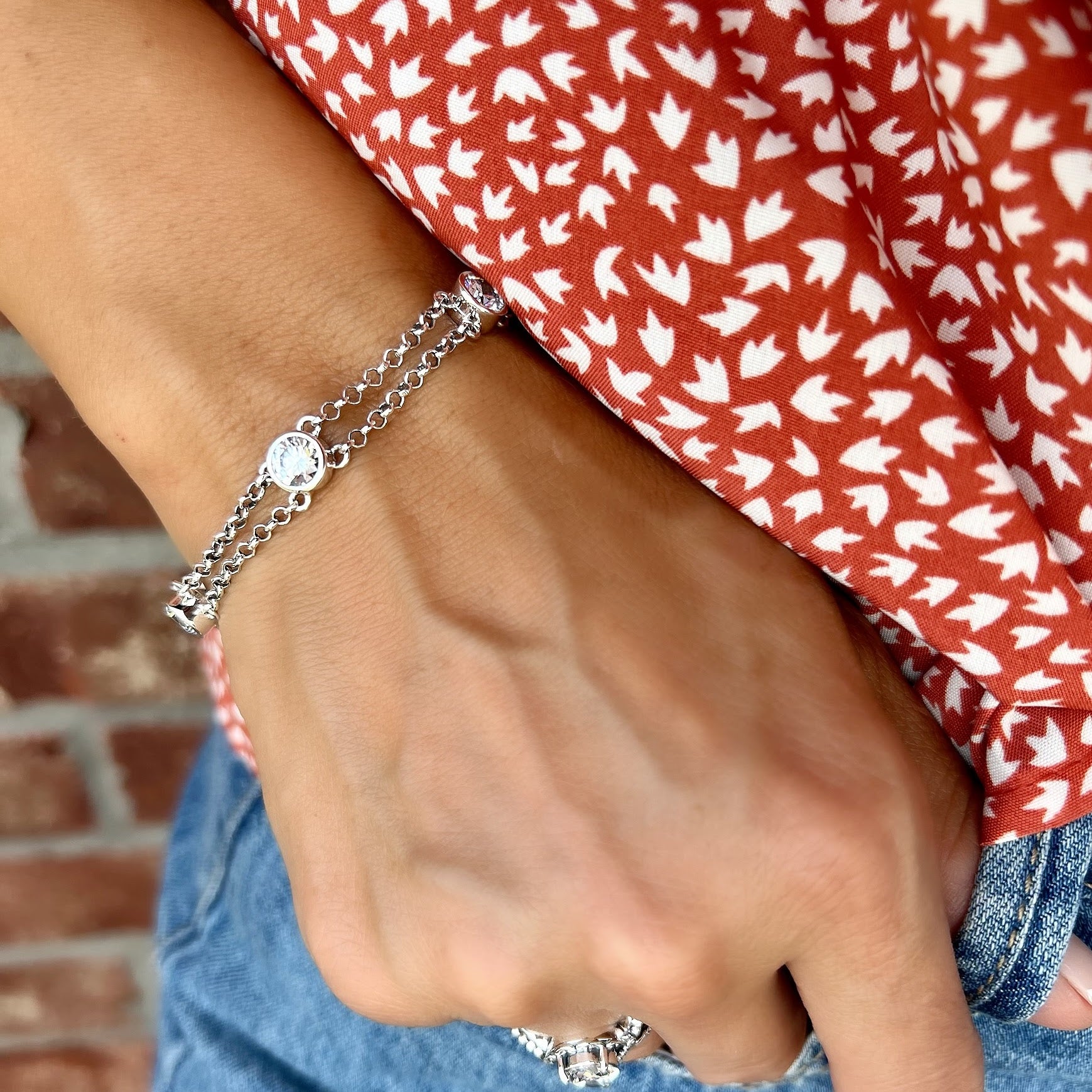 minimalist double chain bracelet featuring cubic zirconia