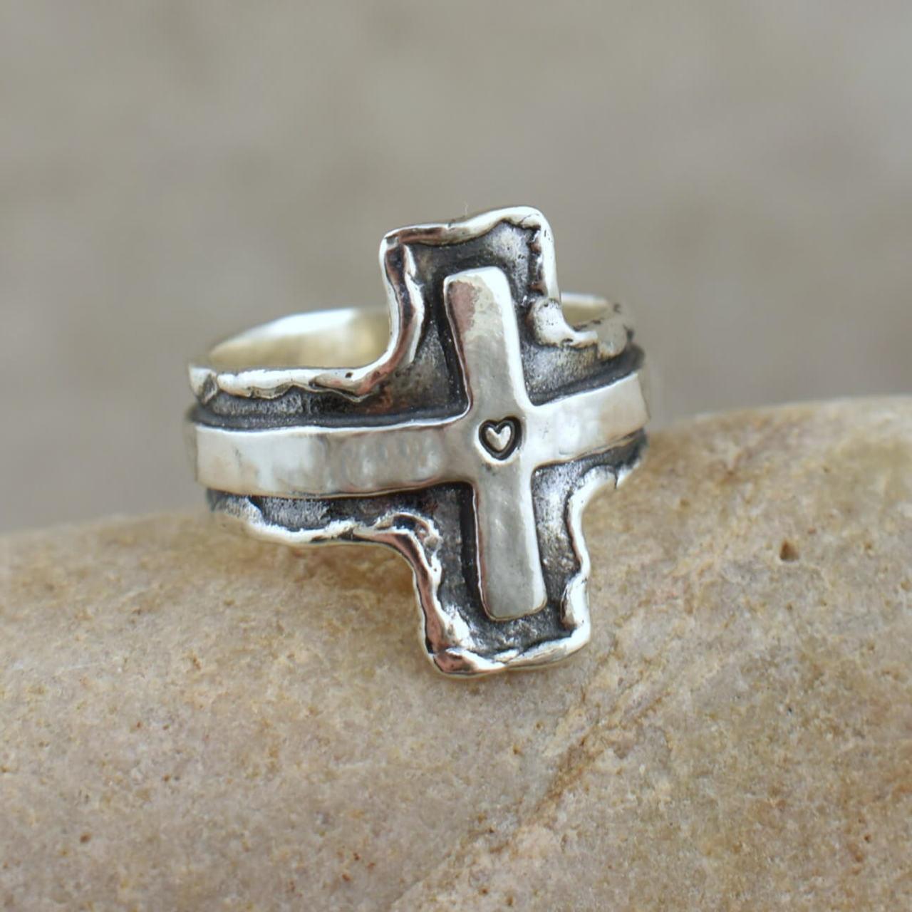Designer ring with heart stamped in the middle