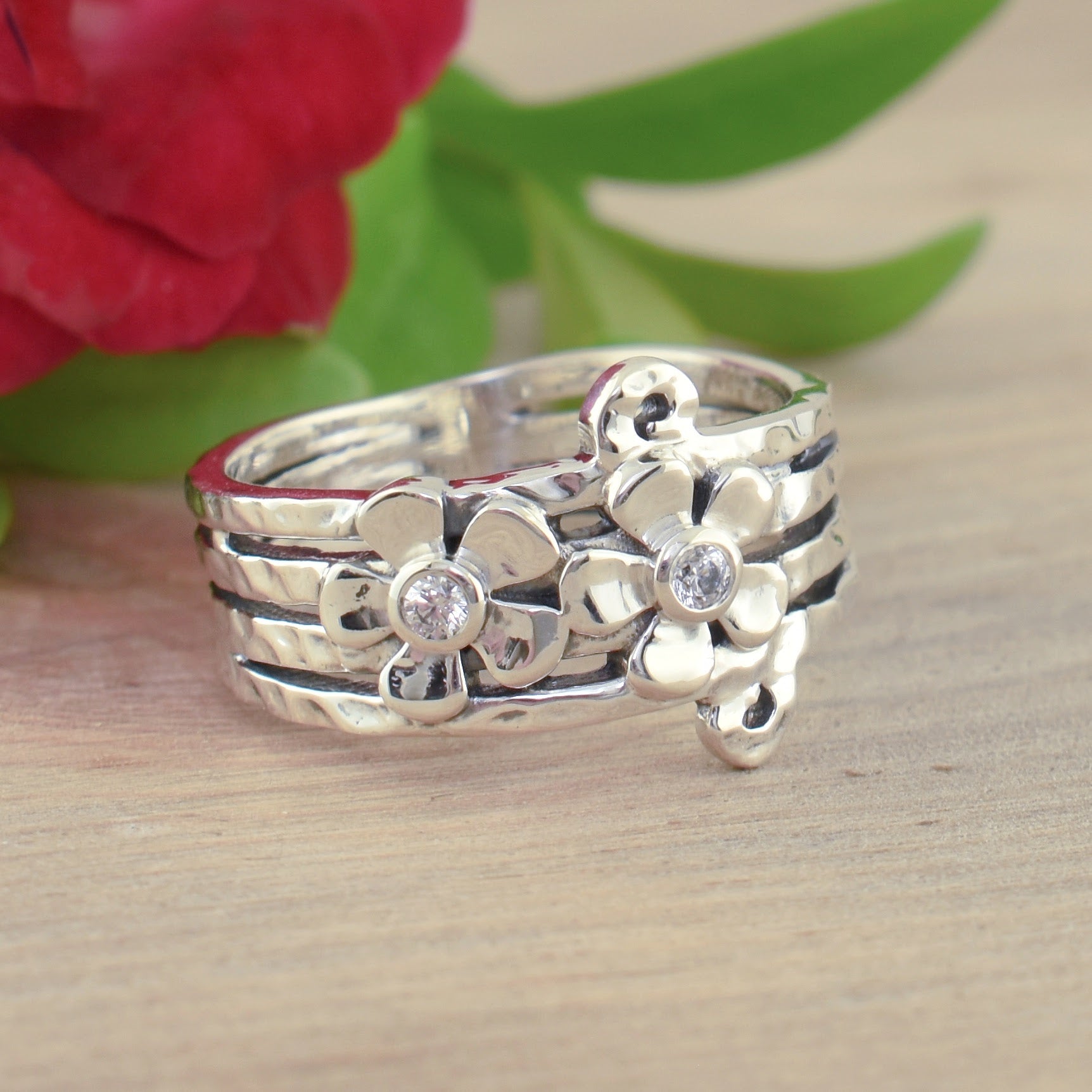 .925 sterling silver hammered ring featuring flowers and CZs