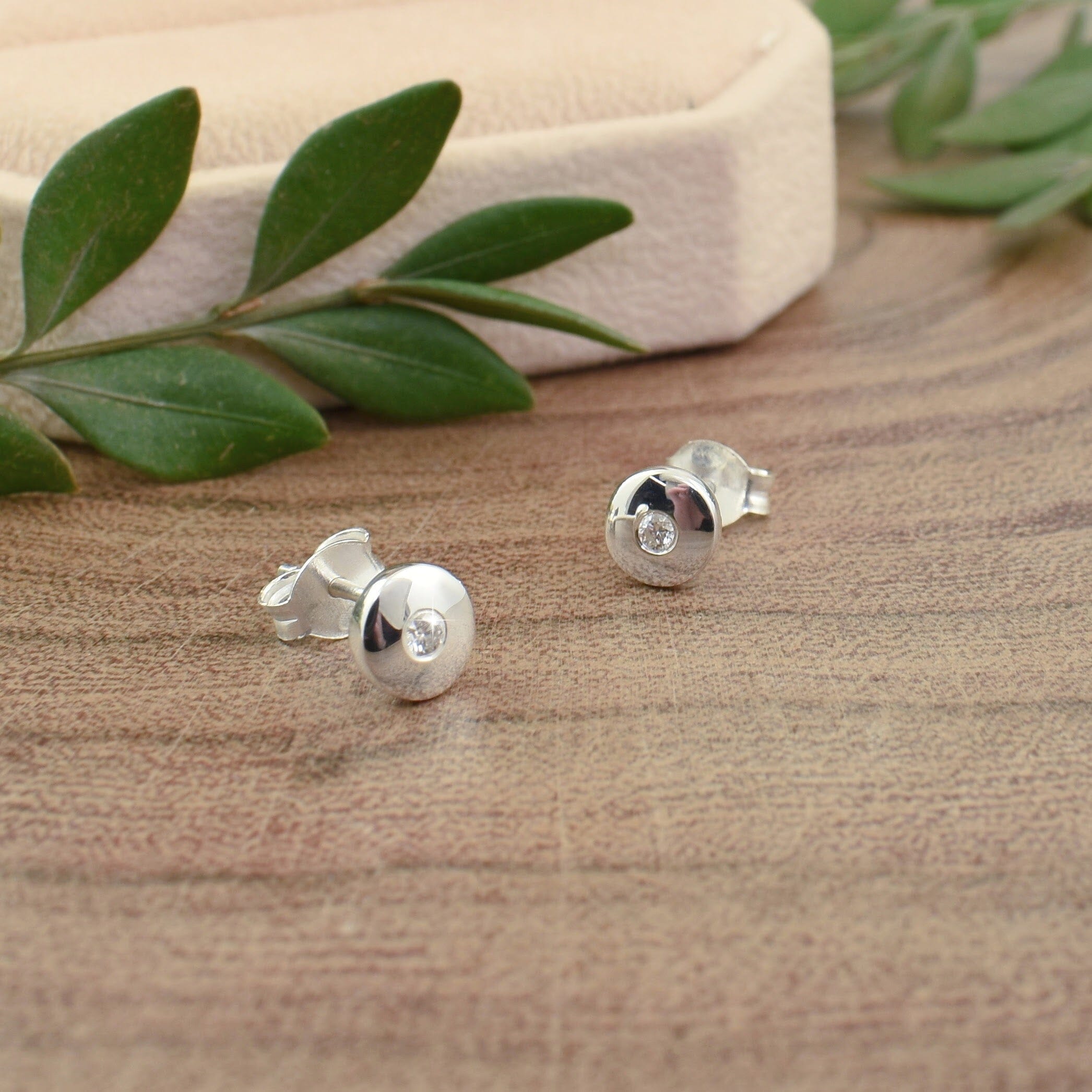 dainty .925 sterling silver post earrings featuring diamonds