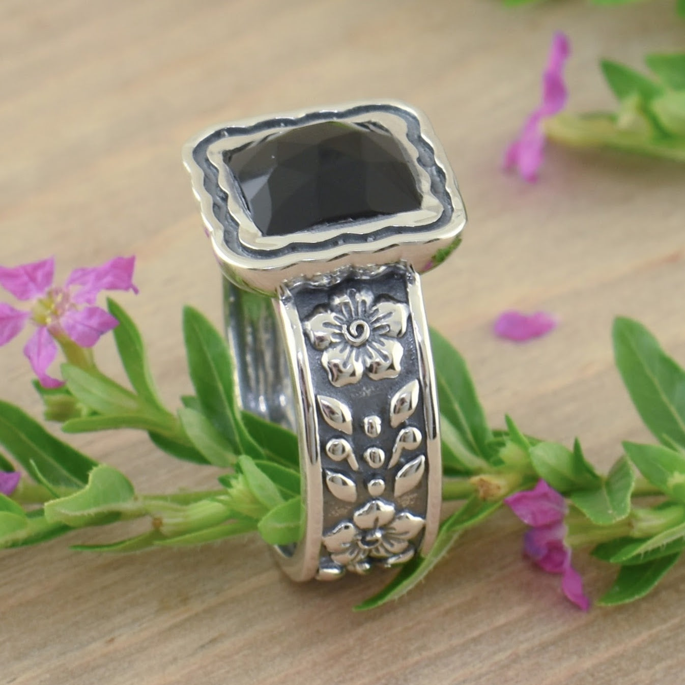 sterling silver ring with floral band and square cut bezel with black onyx