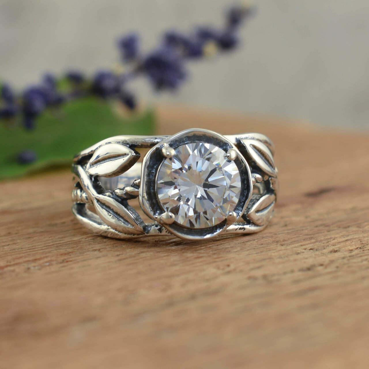 Designer sterling silver ring with vine detail and round cz stone