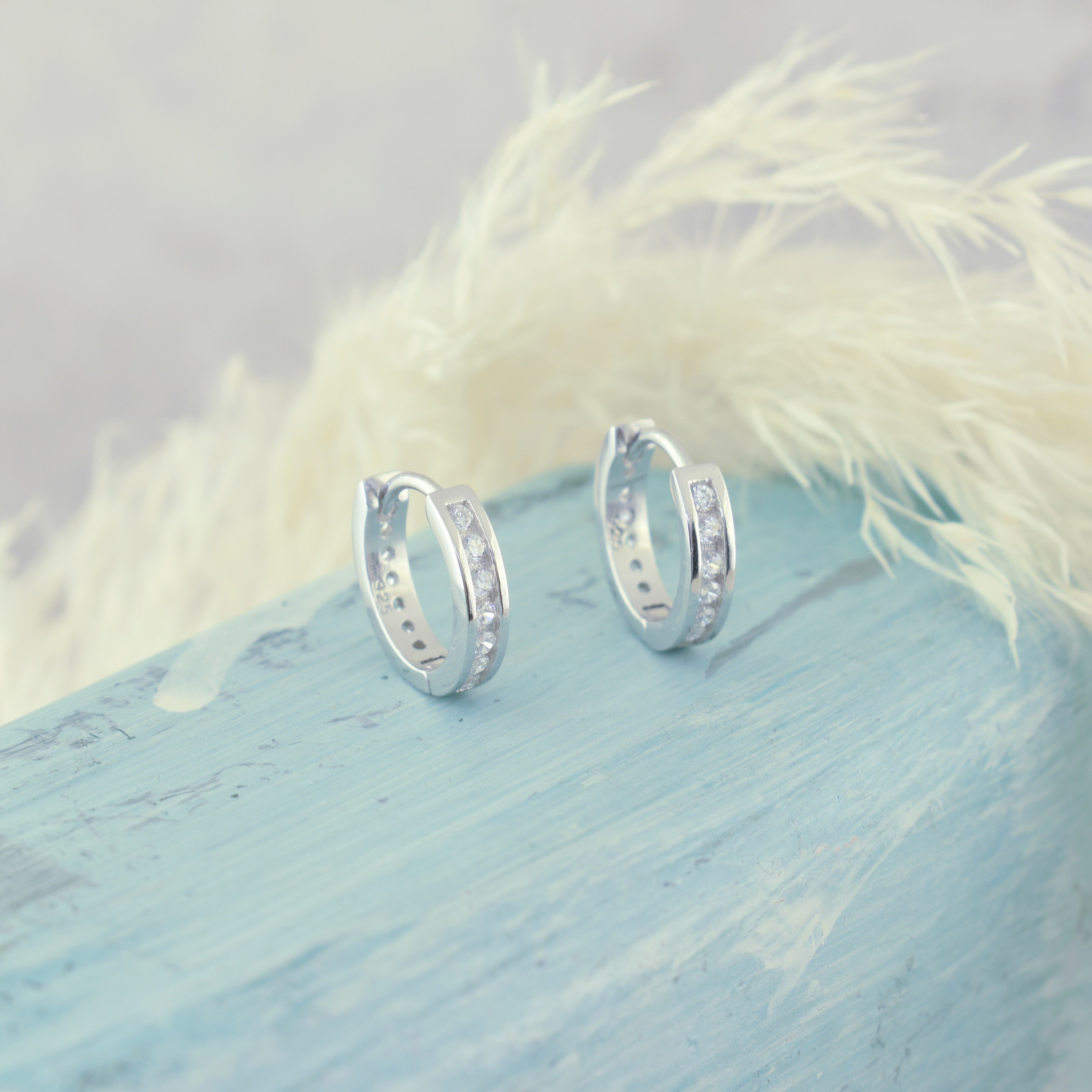 dainty .925 sterling silver hoop earrings featuring cubic zirconia