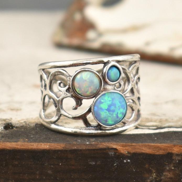 handcrafted white opal and blue opal sterling silver ring.