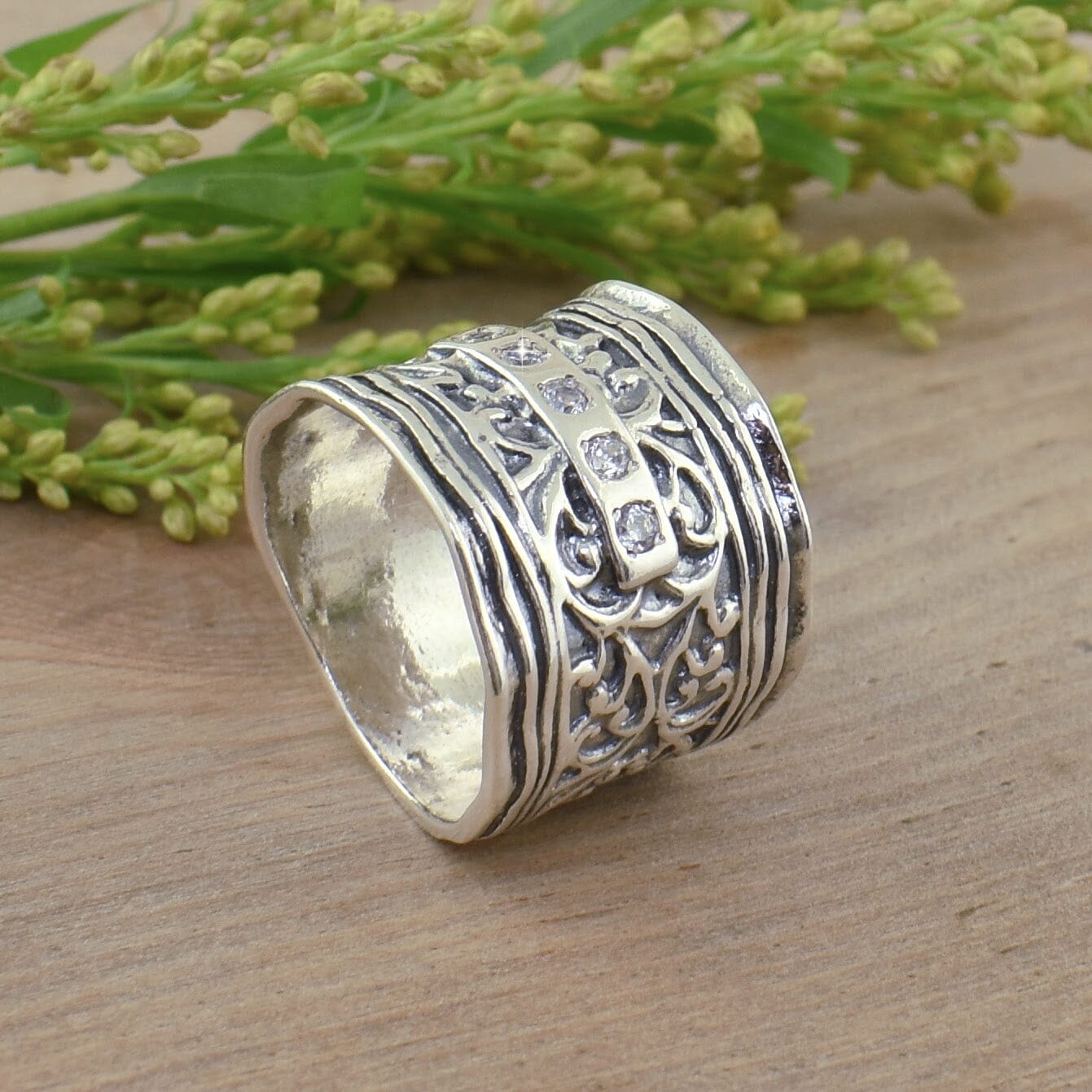 antique style chunky ring featuring cz and a scroll design