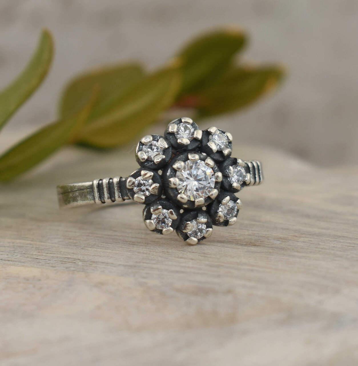 Vintage inspired sterling silver ring with flower design CZ