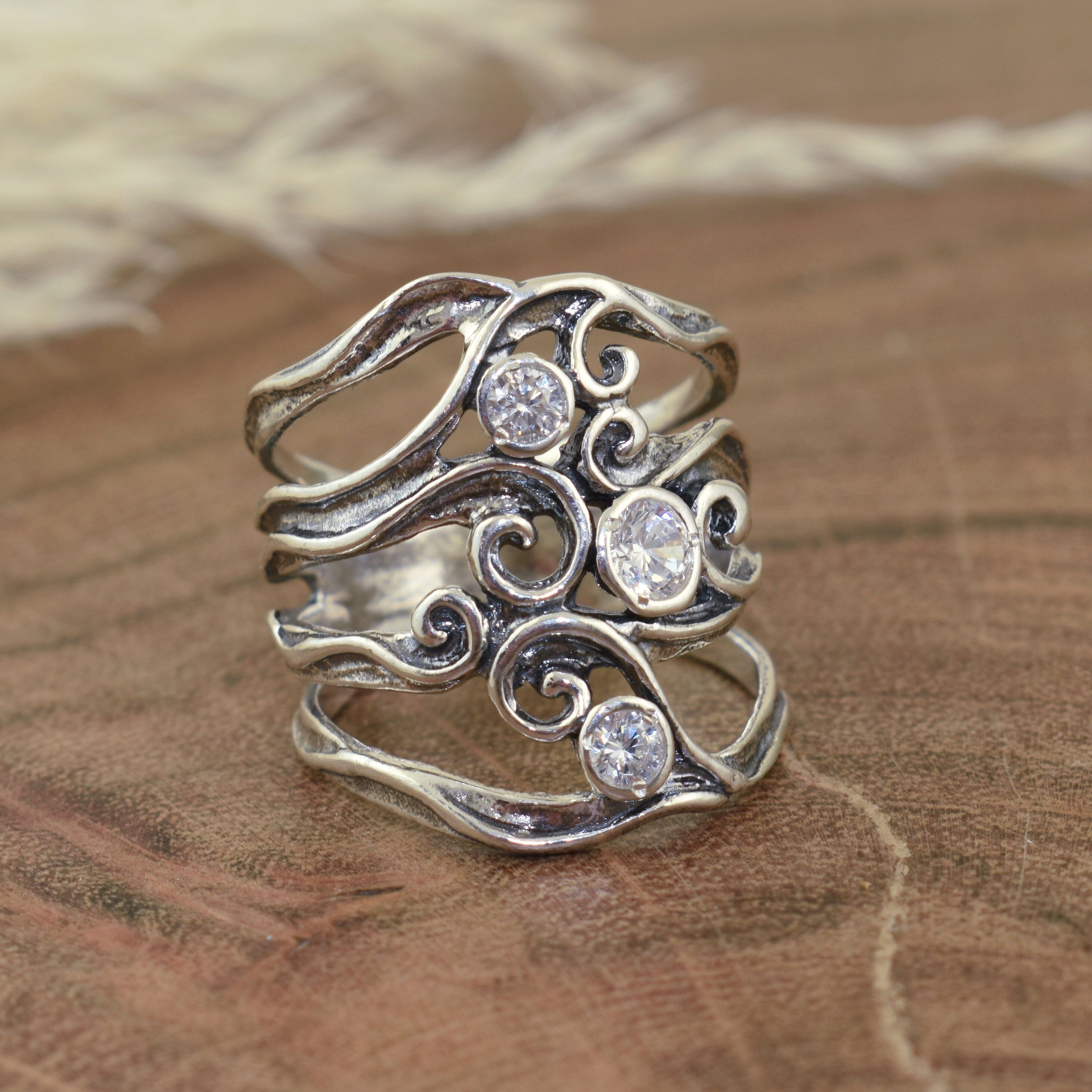 chunky .925 sterling silver ring featuring three round CZs