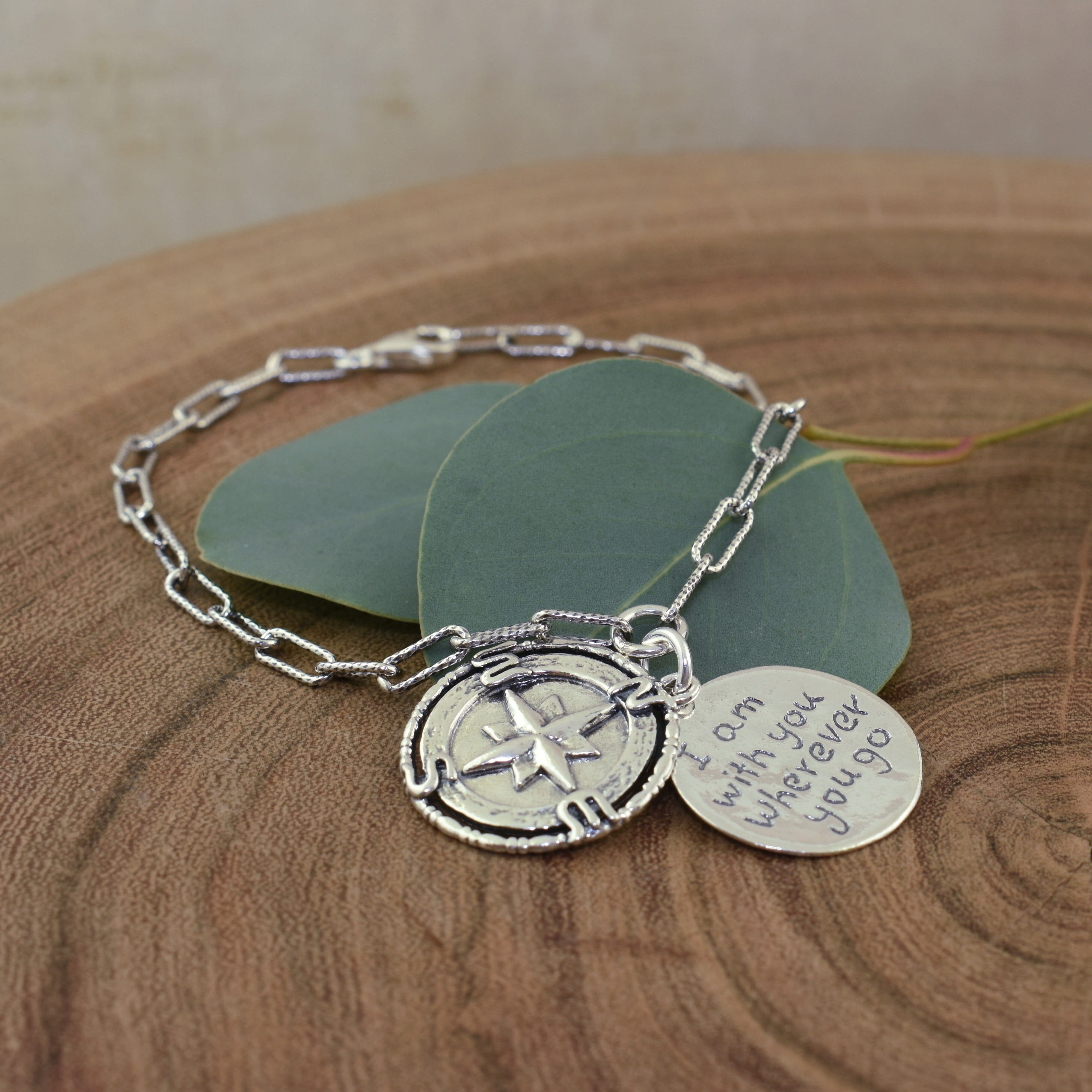 compass bracelet with the saying "I am with you wherever you go"