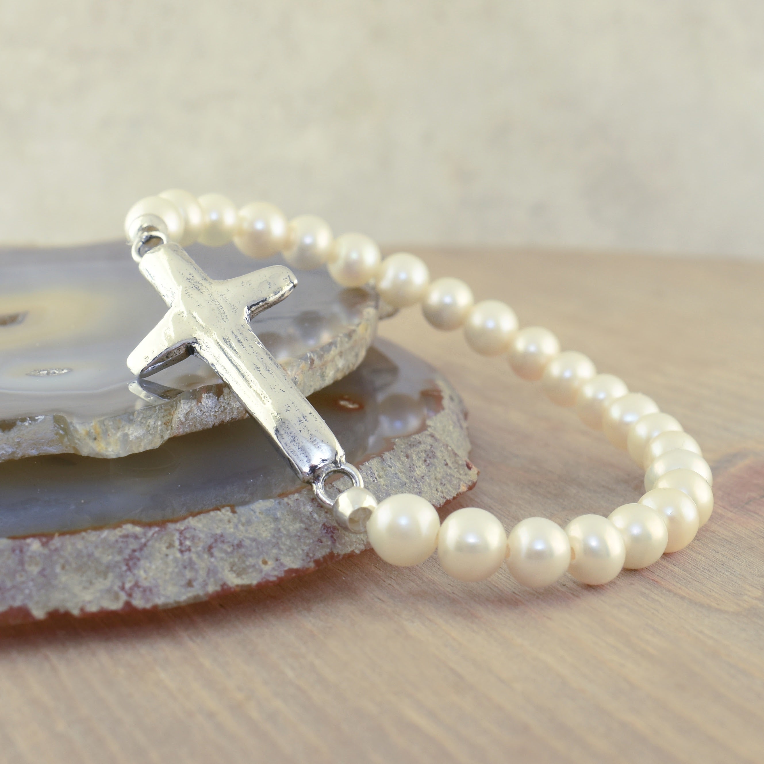 sterling silver cross stretch bracelet with freshwater pearl