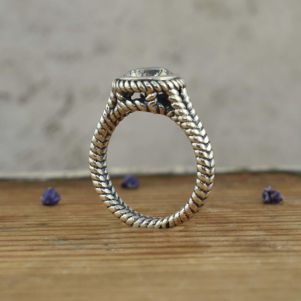 .925 sterling silver rope like ring with round cz stone