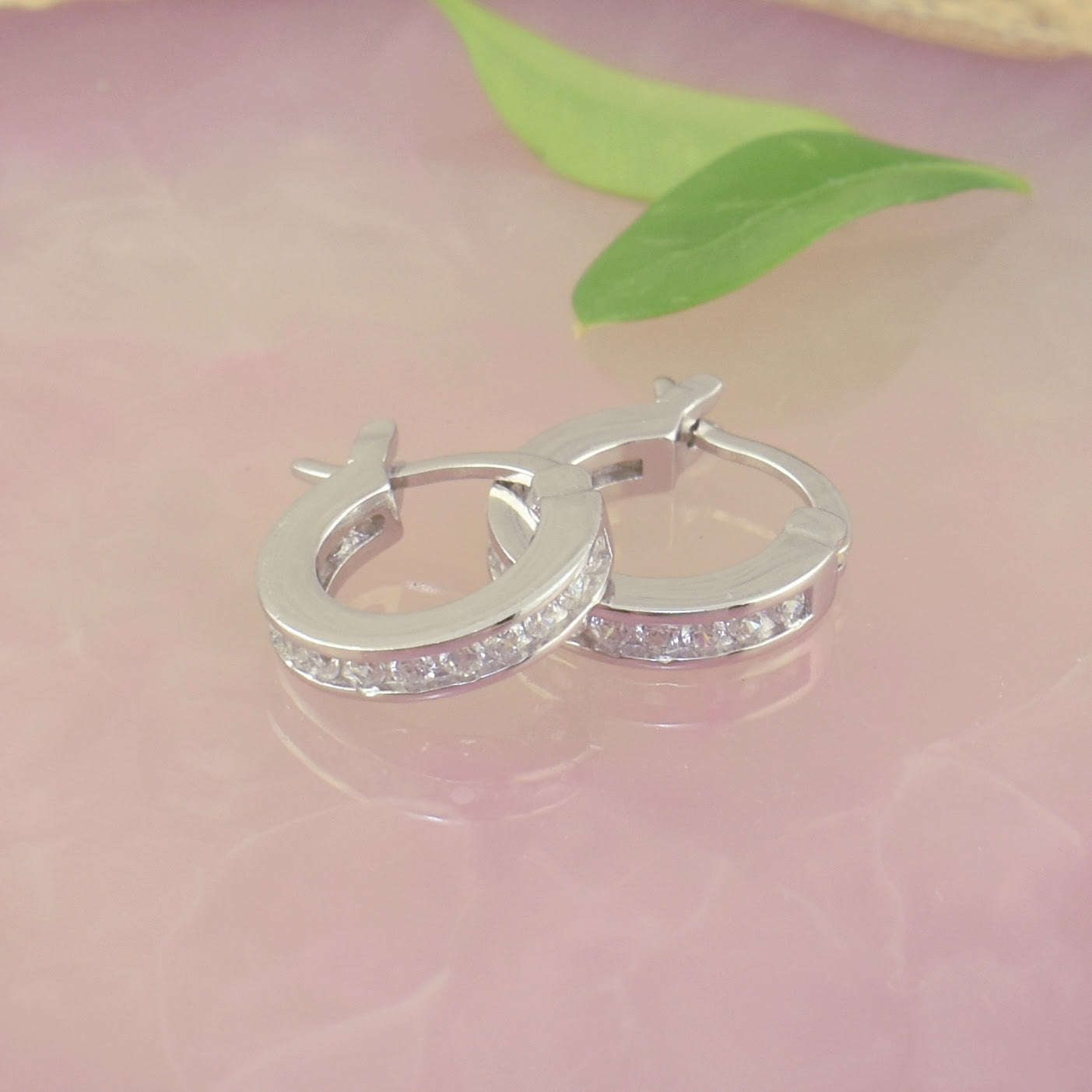 dainty hoop earrings with CZs on the front and back