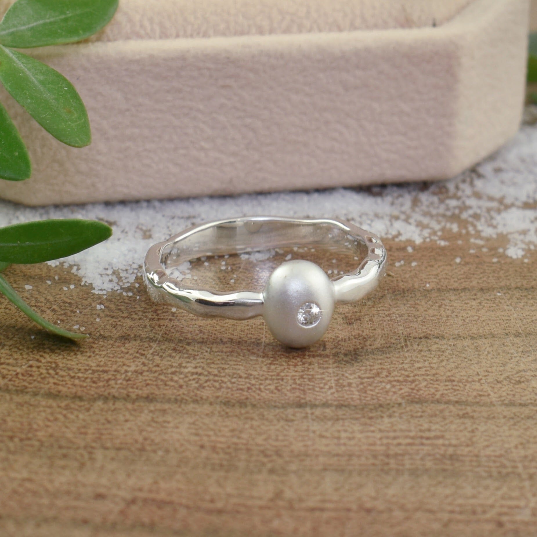 dainty .925 sterling silver ring featuring a tiny diamond