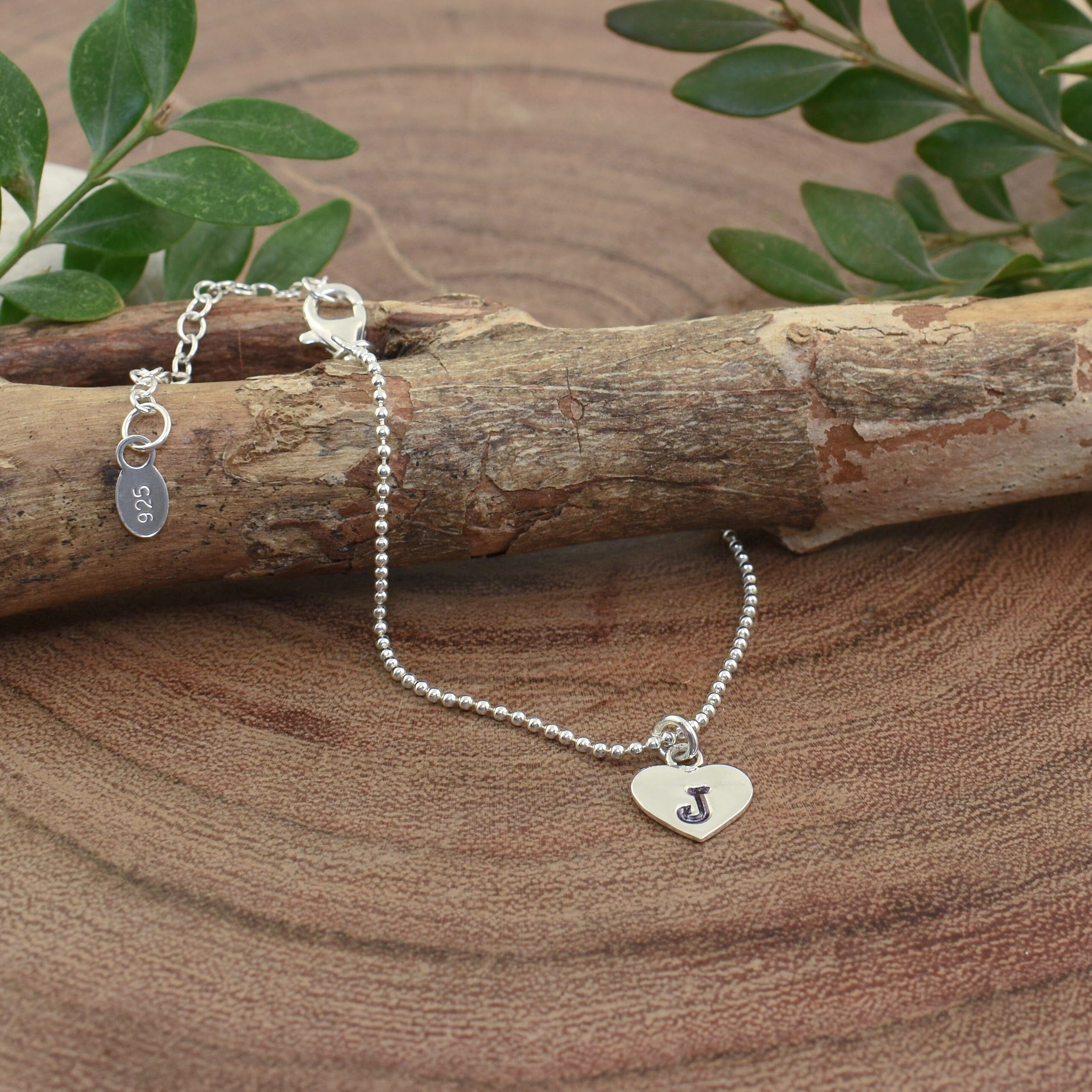 dainty .925 sterling silver adjustable bracelet with a personalized heart disk