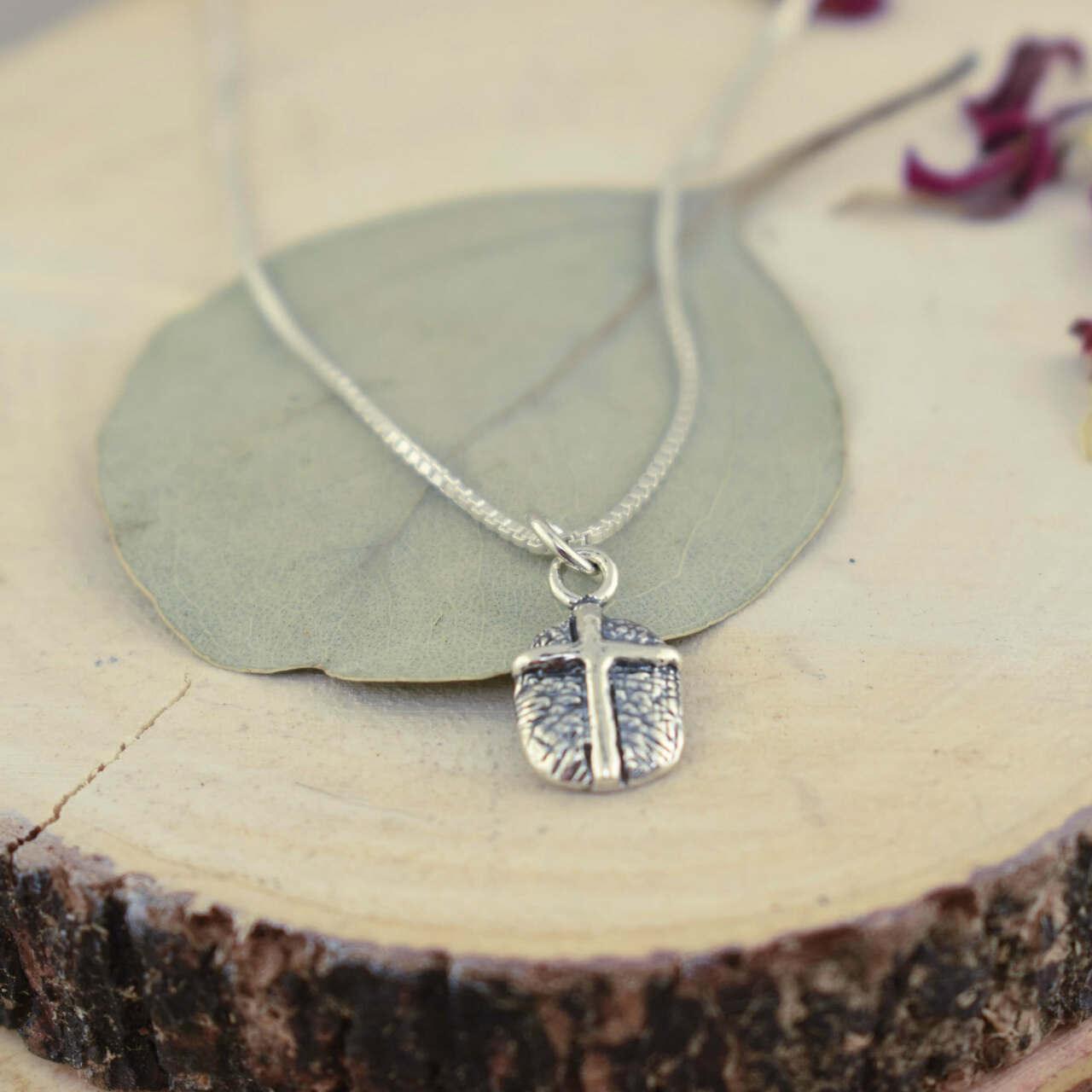Handcrafted sterling silver cross necklace on a 16-inch chain