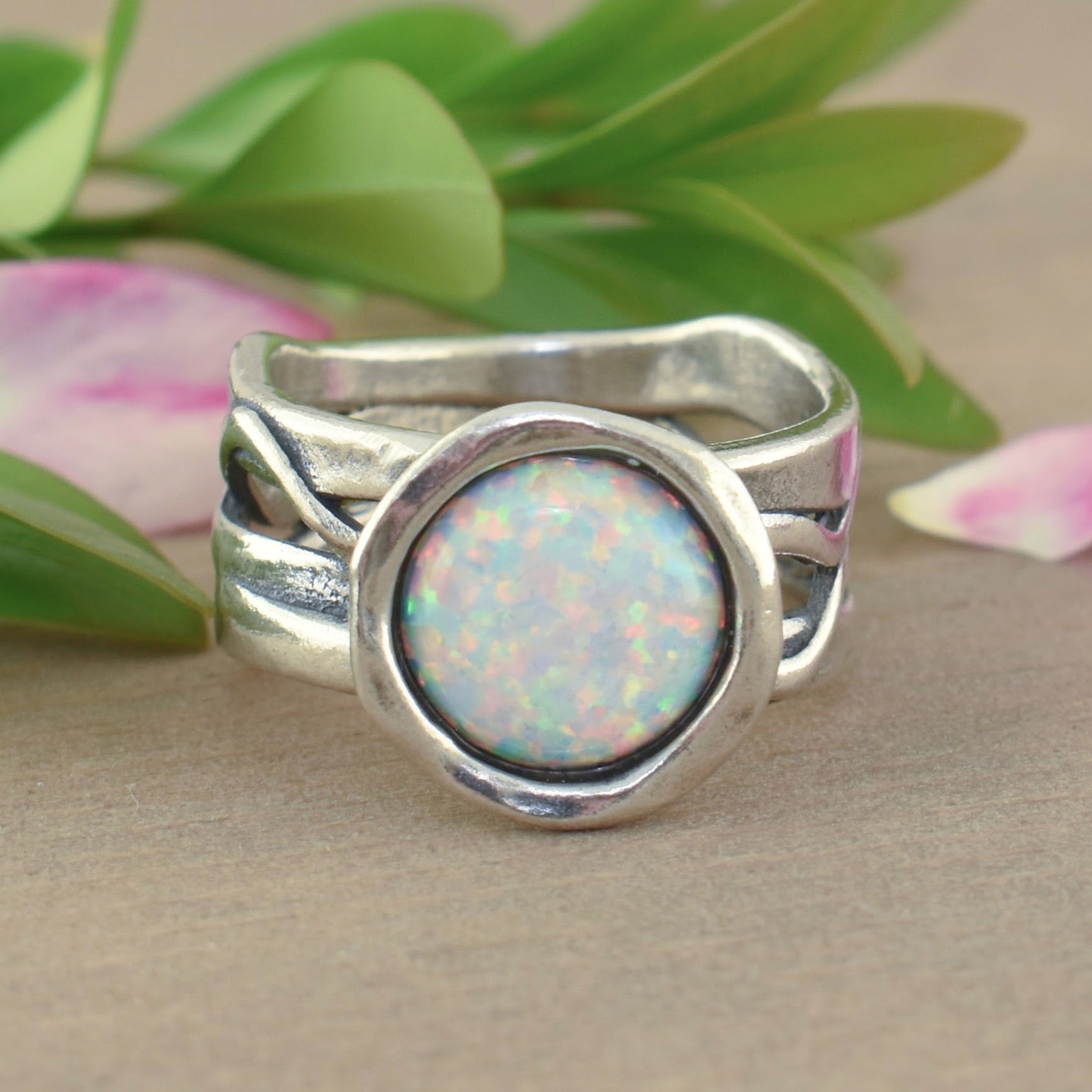 .925 sterling silver ring with bezel set reconstructed opal stone